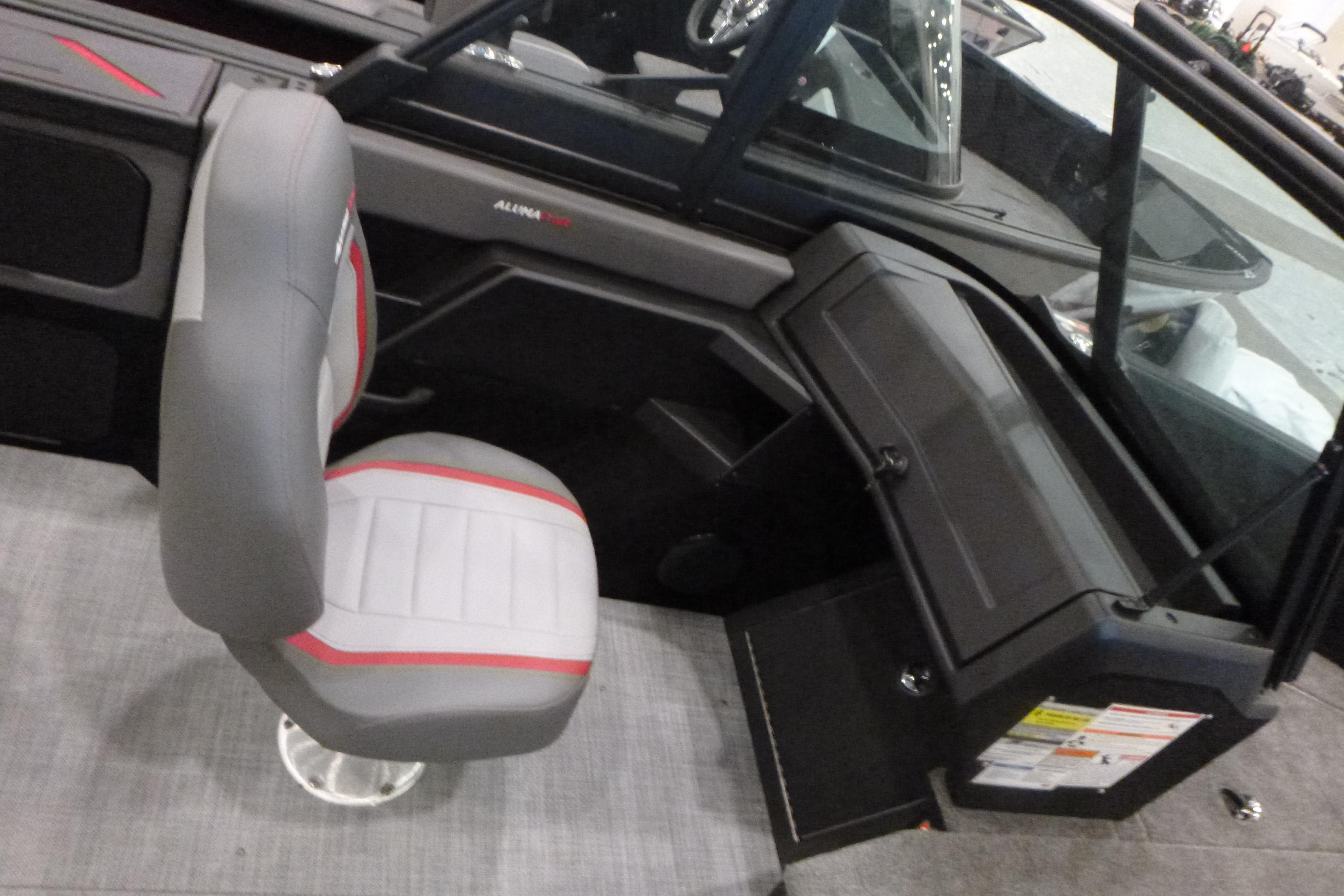 2025 Alumacraft Trophy 185X Sport interior with gray and red seating.