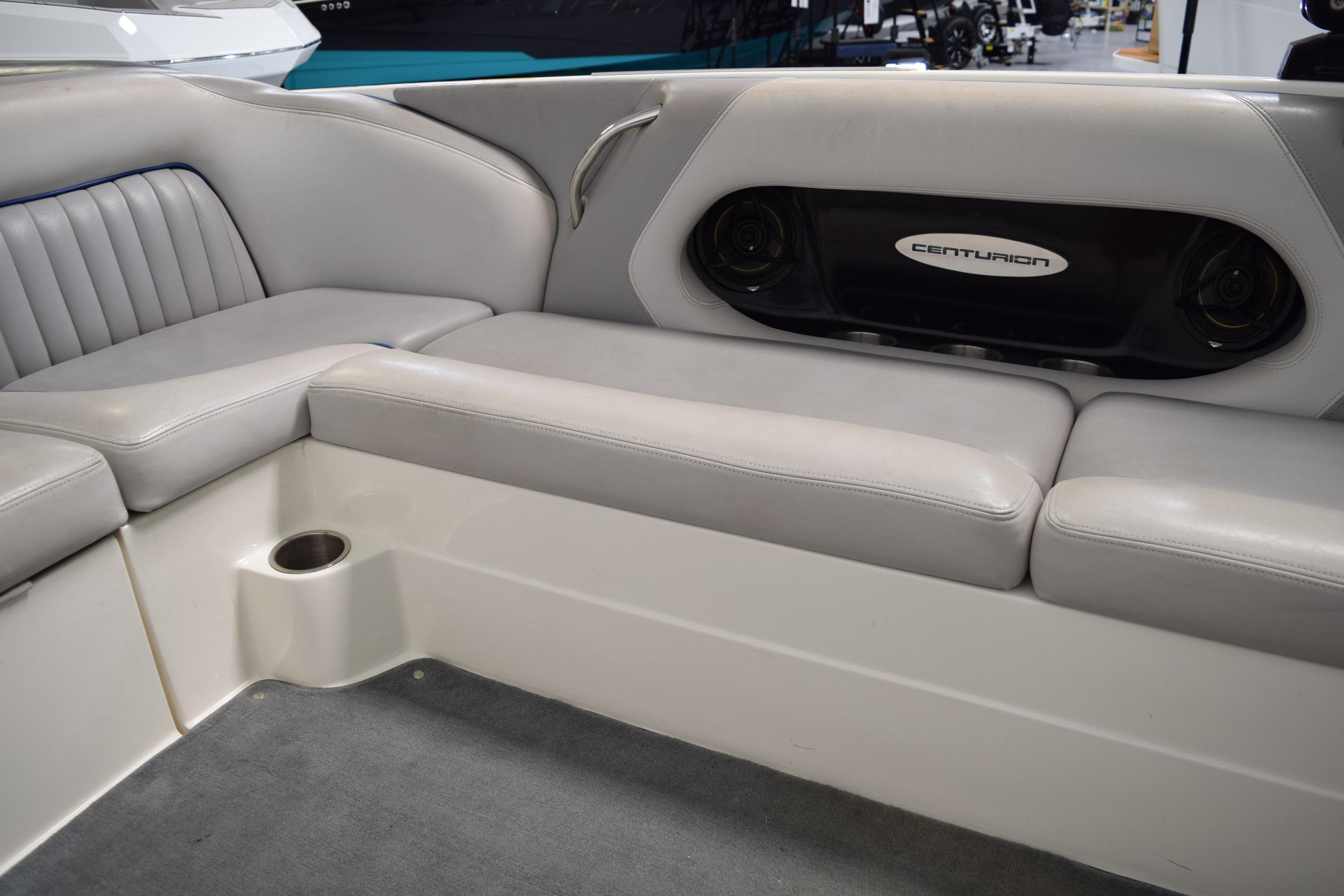 Luxurious seating in a 2007 Centurion SV 240 boat with integrated speakers.