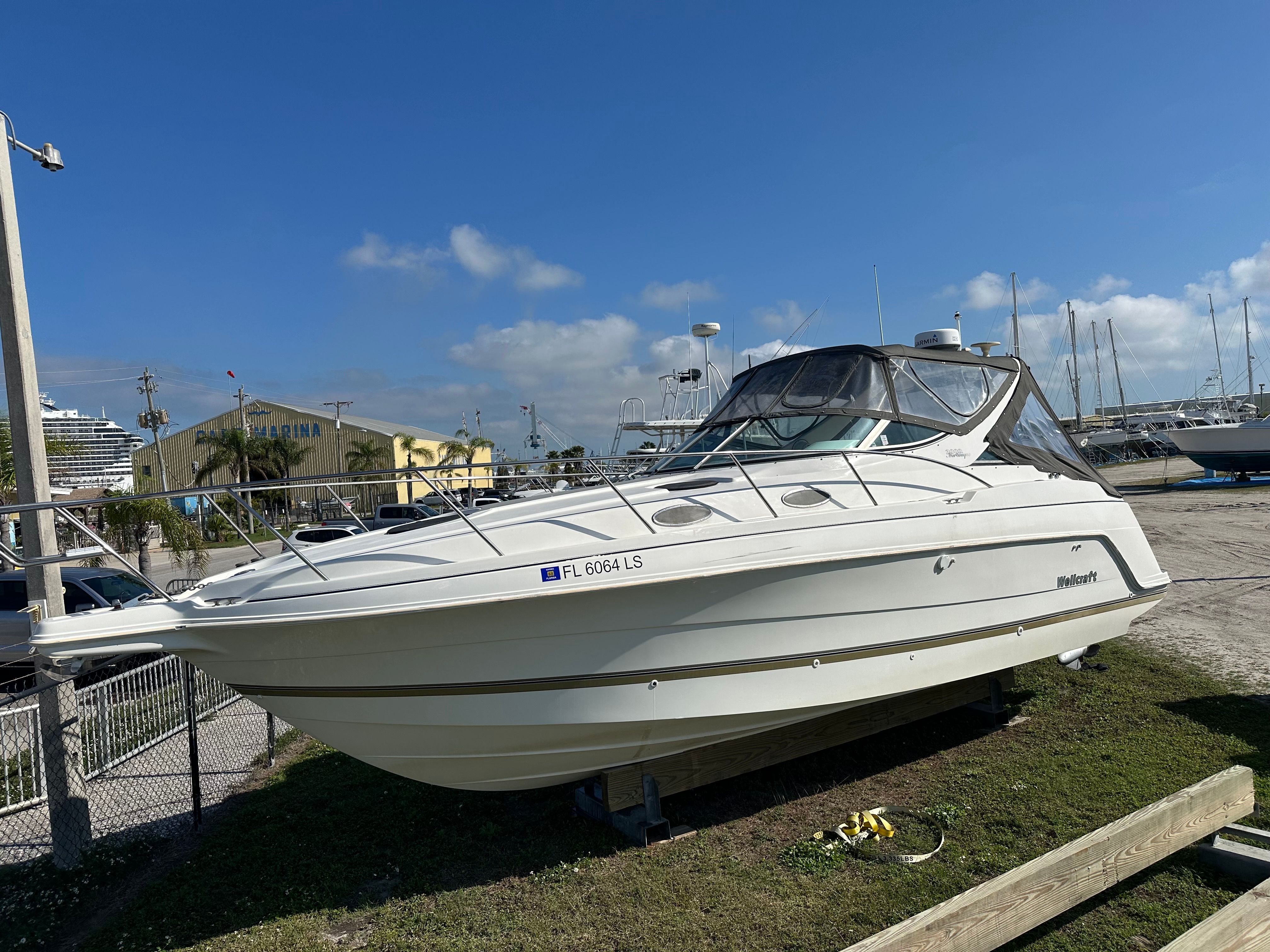1999 Wellcraft 3000 Matrinique boat on a dry dock.