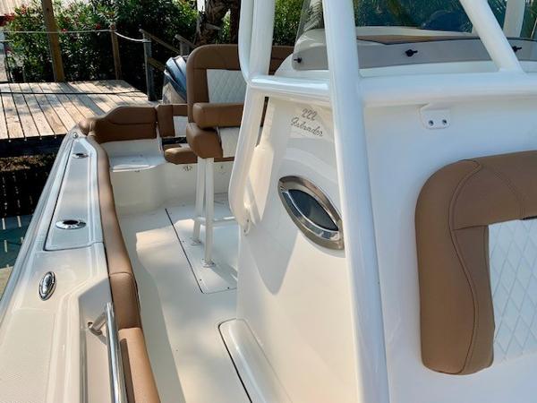 2025 Pioneer 222 Islander boat interior with tan and white seating.