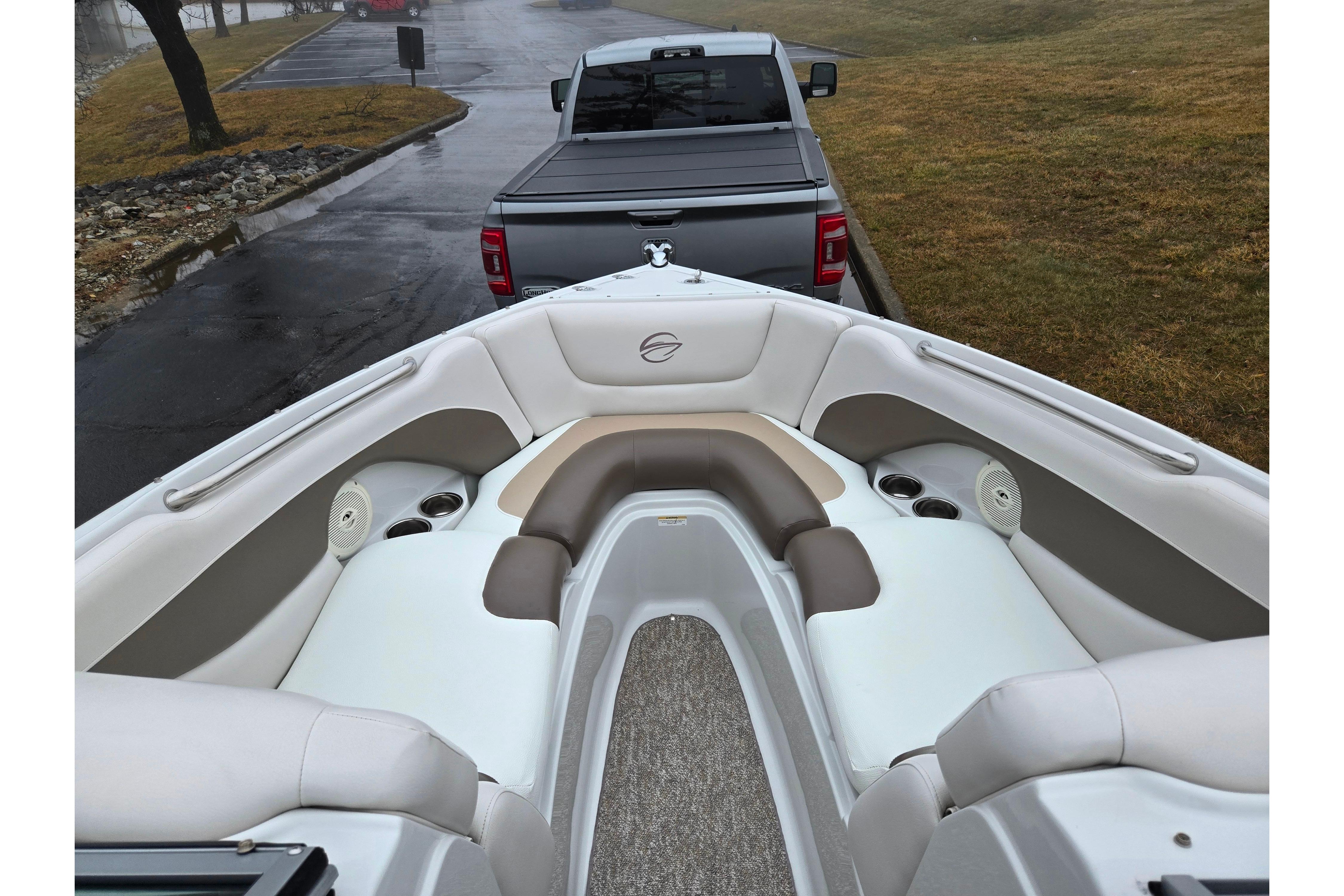 2012 Crownline 235 SS boat interior with seating, parked on a trailer.