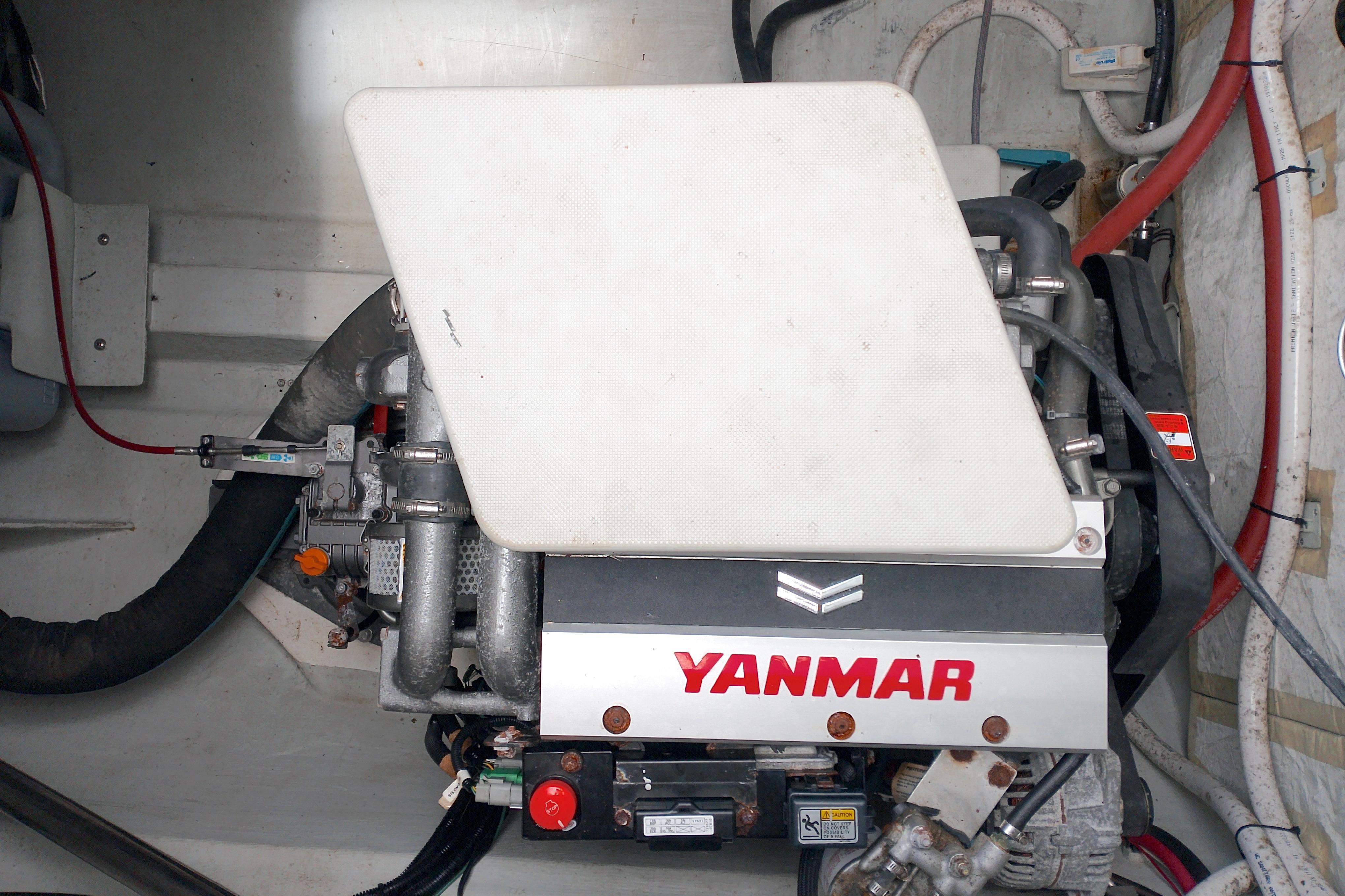 Engine compartment of 2023 Seawind 1600 Passagemaker with Yanmar engine.