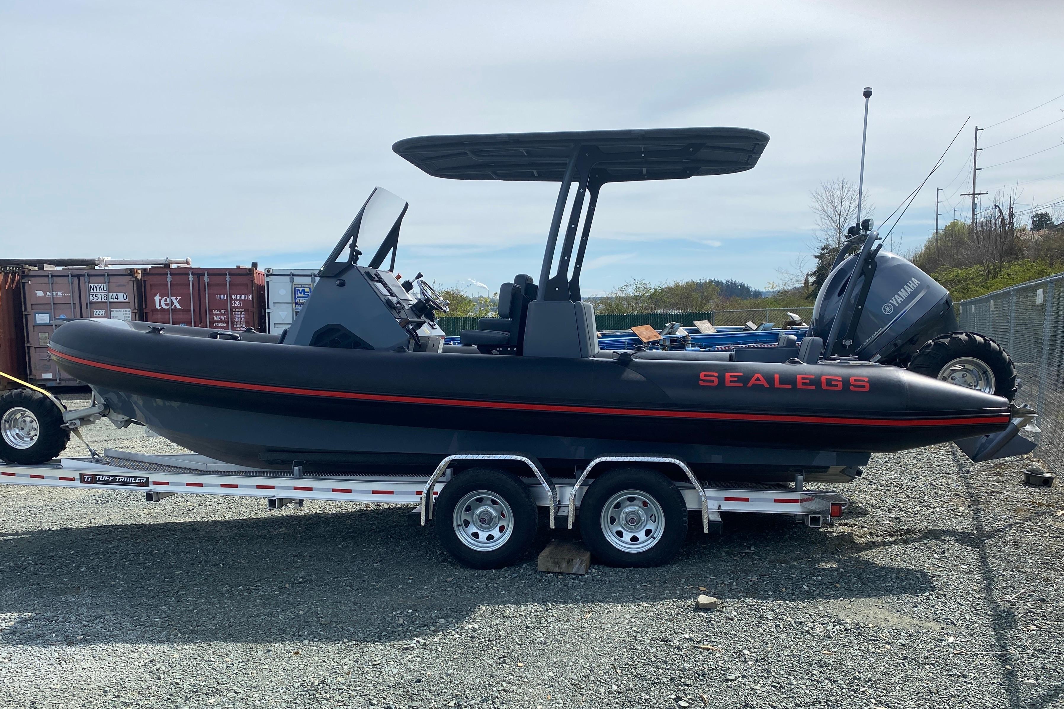 2024 Sealegs 7.5 boat on trailer, featuring Yamaha engine, parked outdoors.
