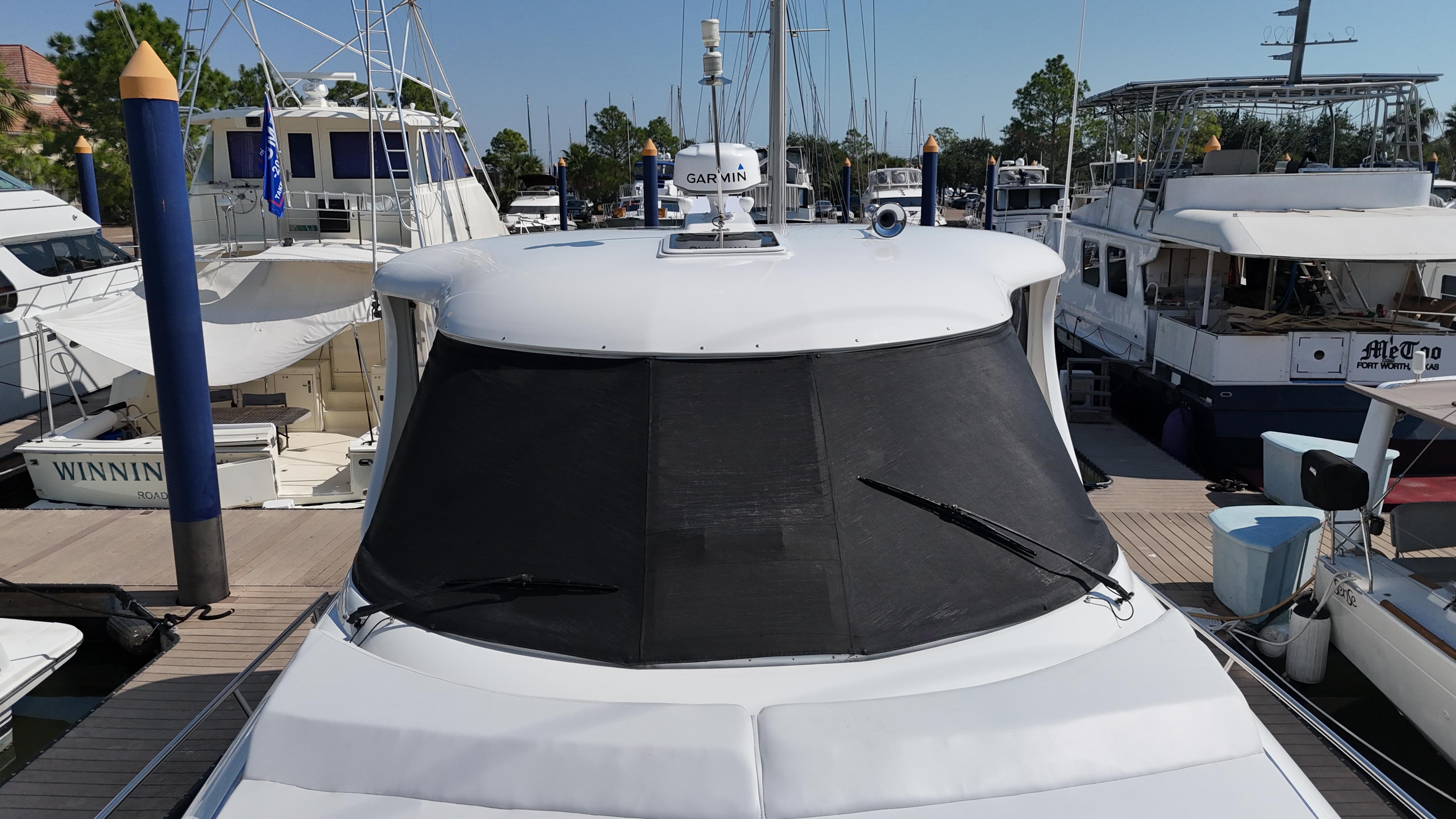 2007 Sea Ray 40 Motor Yacht docked at marina, front view.