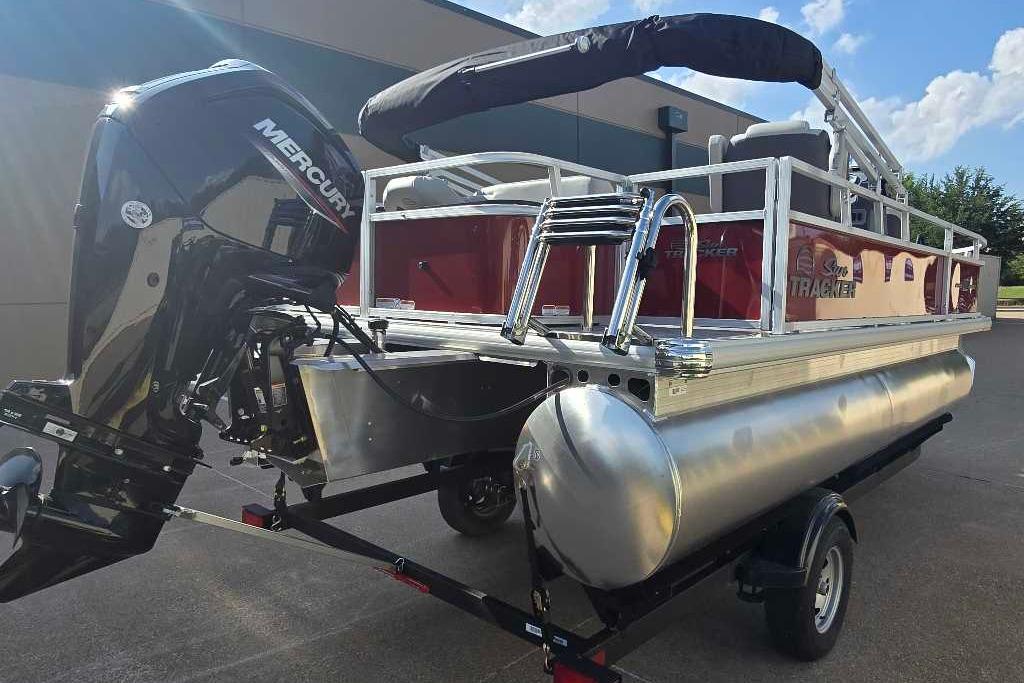 2026 Sun Tracker Bass Buggy 18 DLX pontoon boat with Mercury outboard motor.