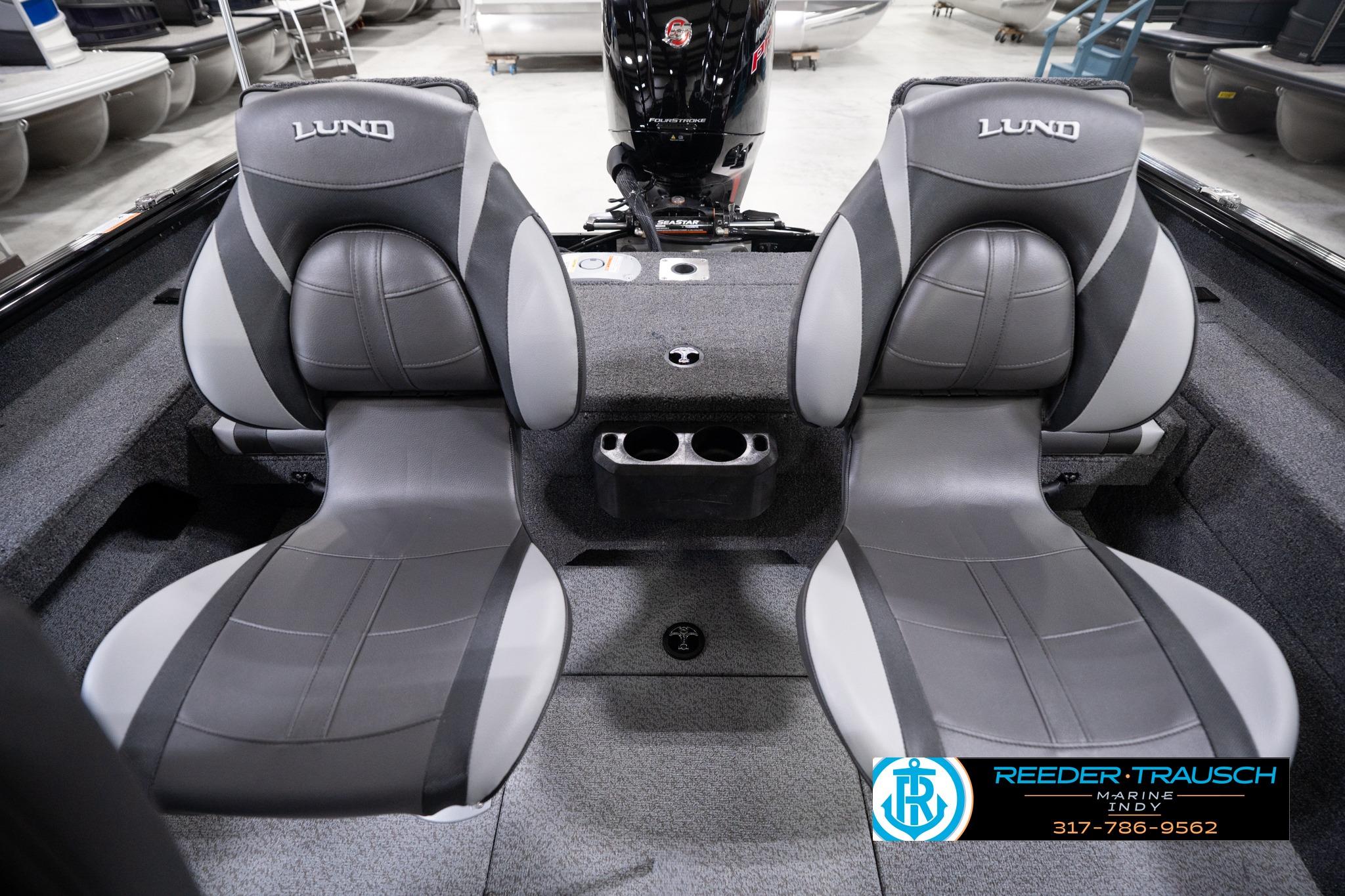 2026 Lund 1775 Impact XS SS boat interior with gray seating and cup holders.