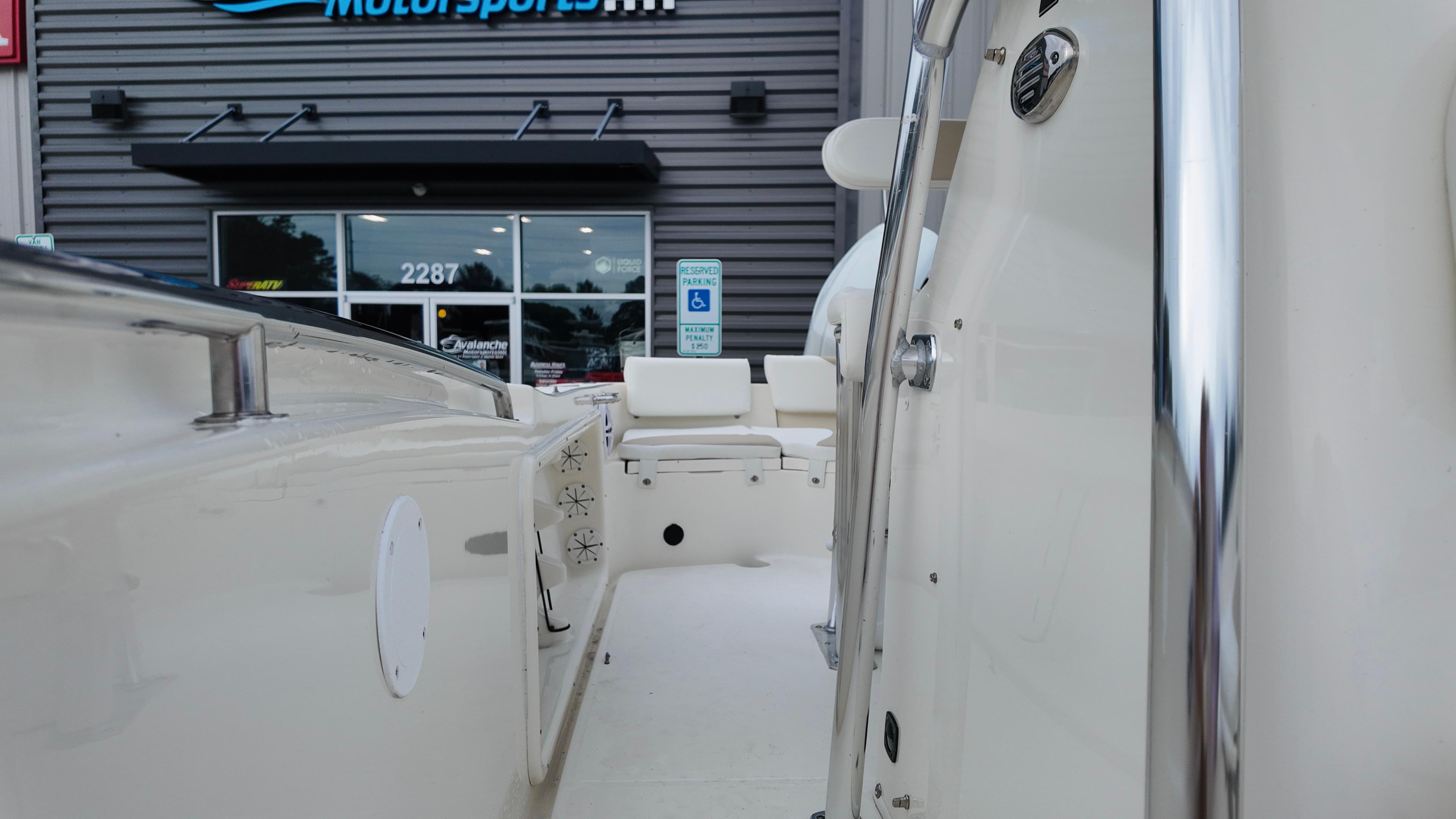 2025 Bulls Bay 200 CC boat interior at dealership, showcasing seating and controls.