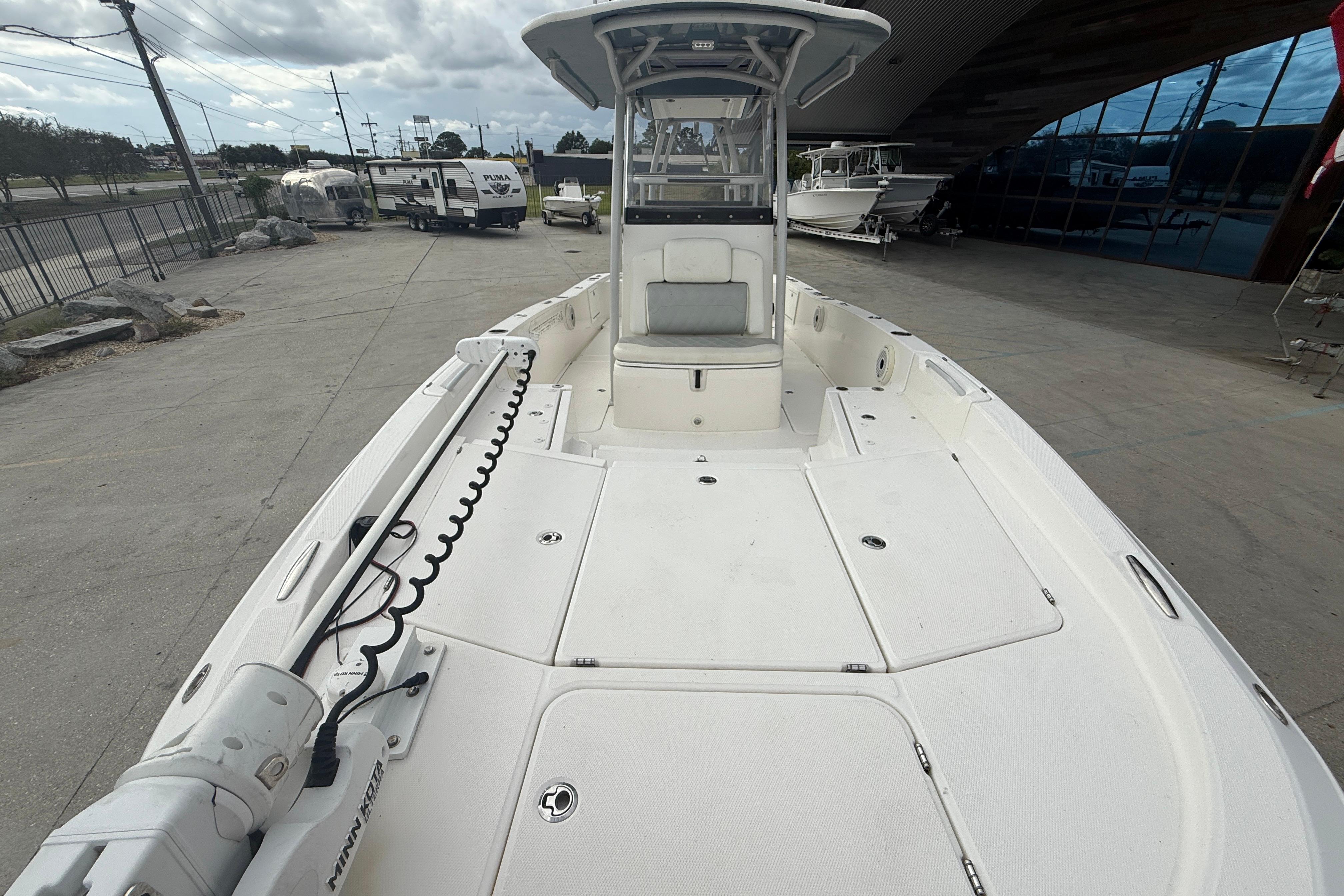 2021 Sea Cat 260 boat with spacious deck and modern design in a marina setting.