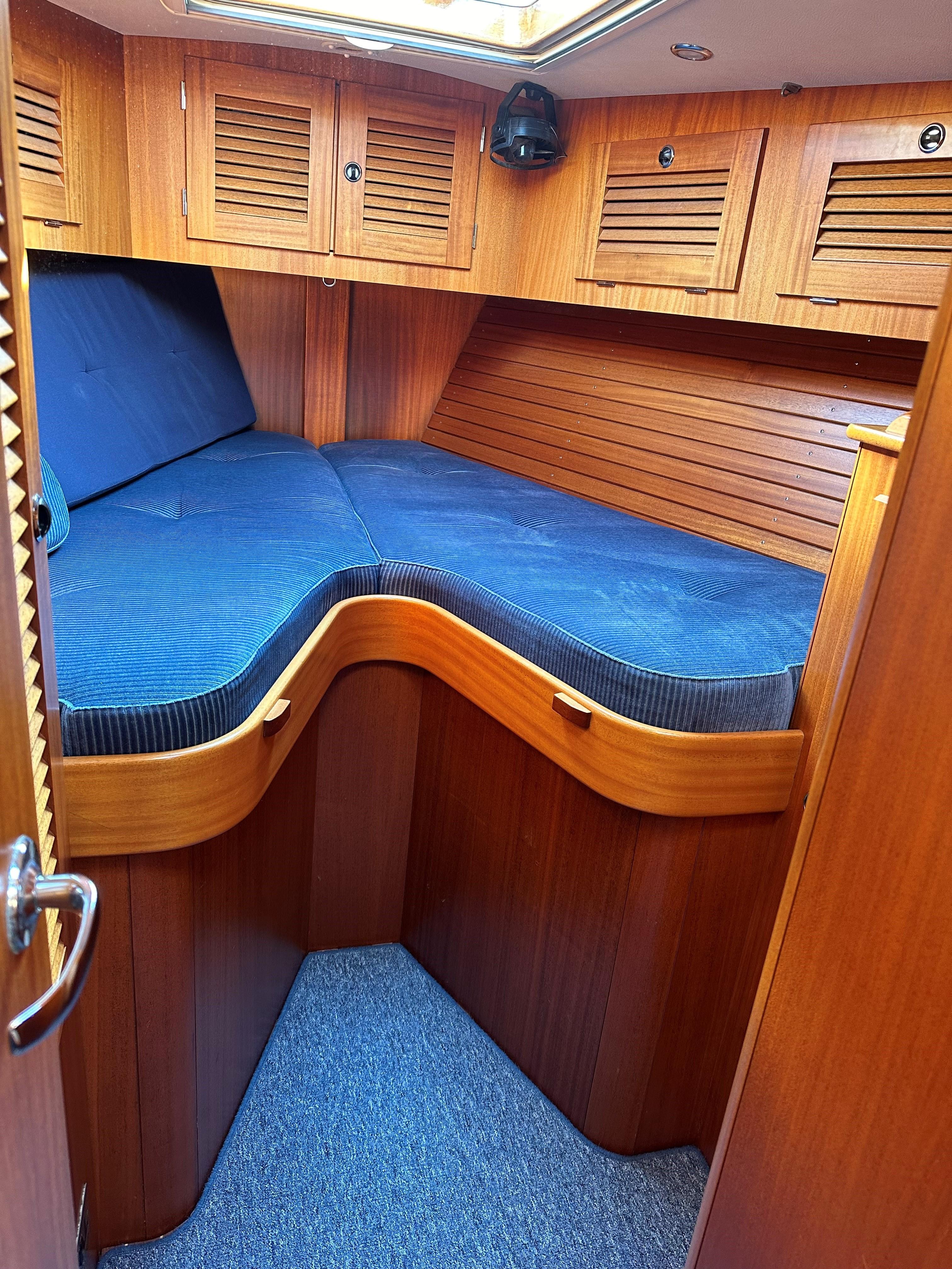 Interior of a 2004 Hallberg-Rassy 53 yacht with wooden finish.