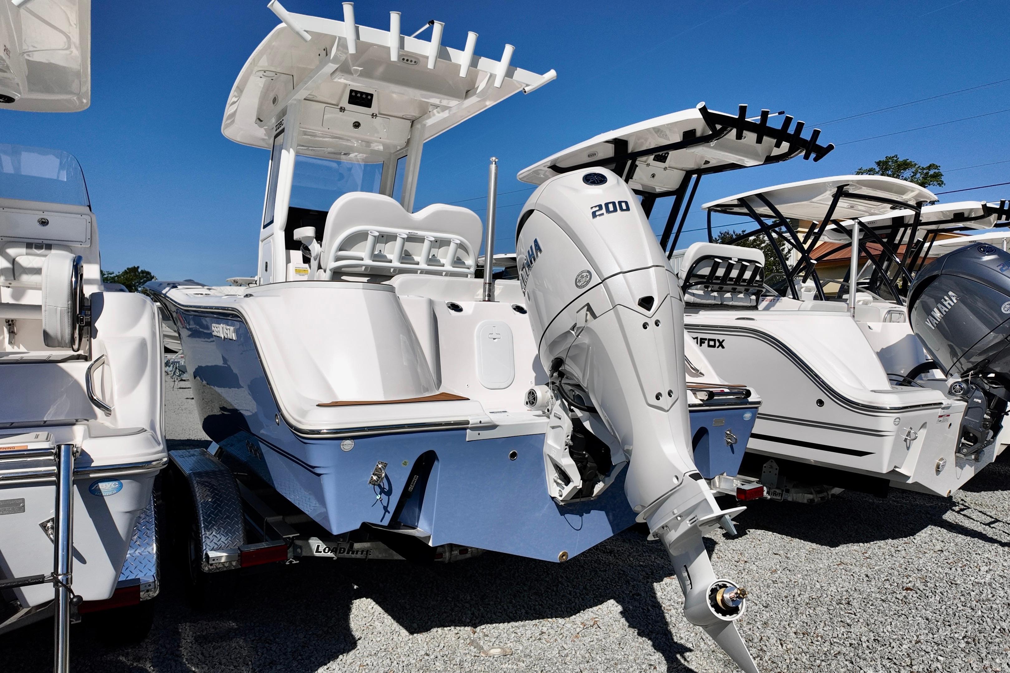 2026 Sea Fox 228 Commander boat with Yamaha 200 engine, displayed outdoors.