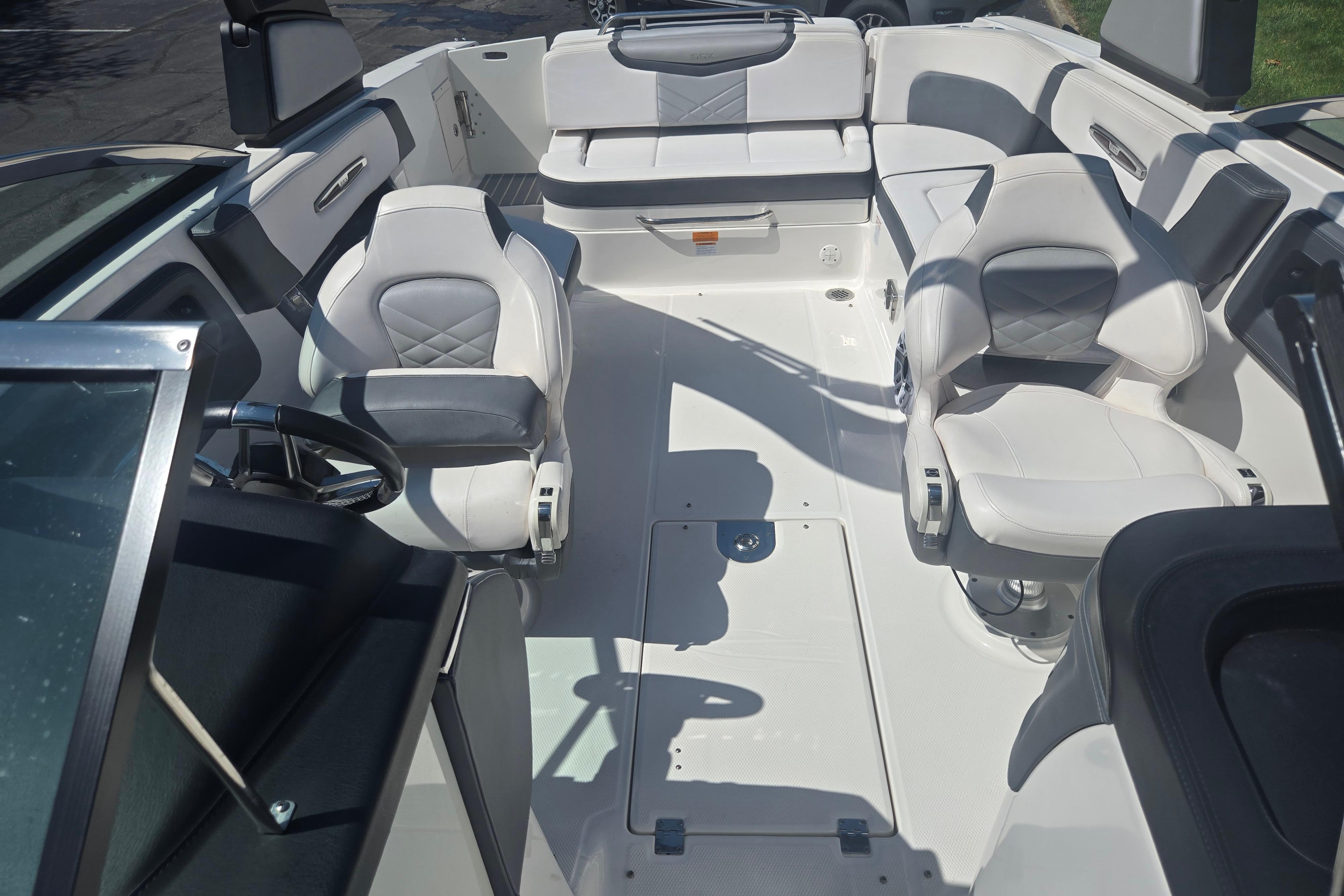 2018 Chaparral 267 SSX boat interior with white seating and steering wheel.