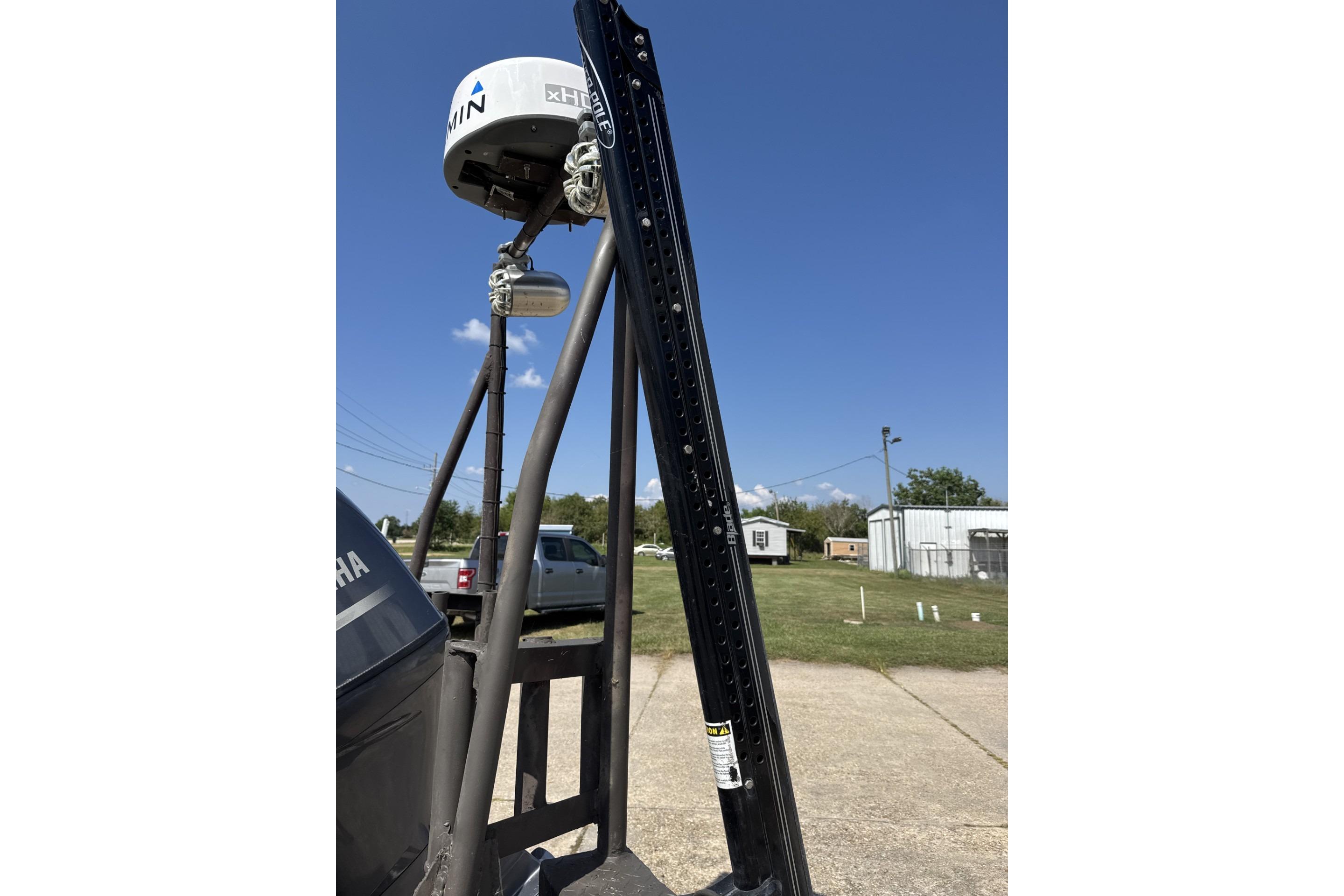 2022 Alweld 2270 Large Flat Bottom boat with radar equipment, outdoor setting.