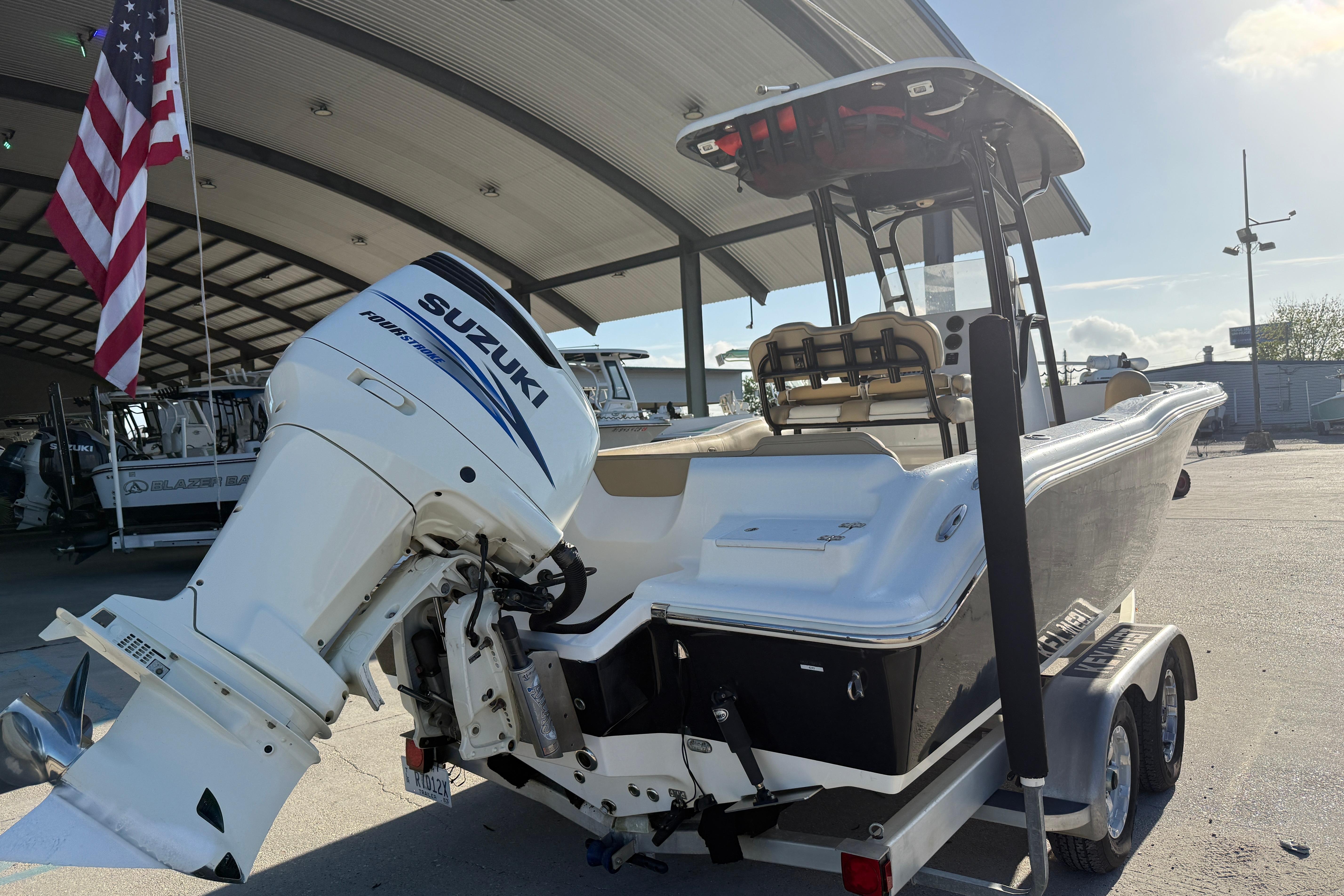 2016 Key West 239 FS boat with Suzuki outboard motor on trailer.