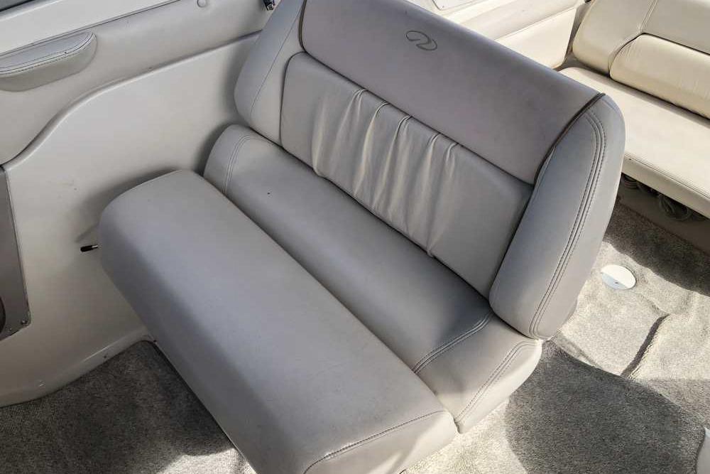 1999 Regal Commodore 2760 boat interior with gray leather seating.