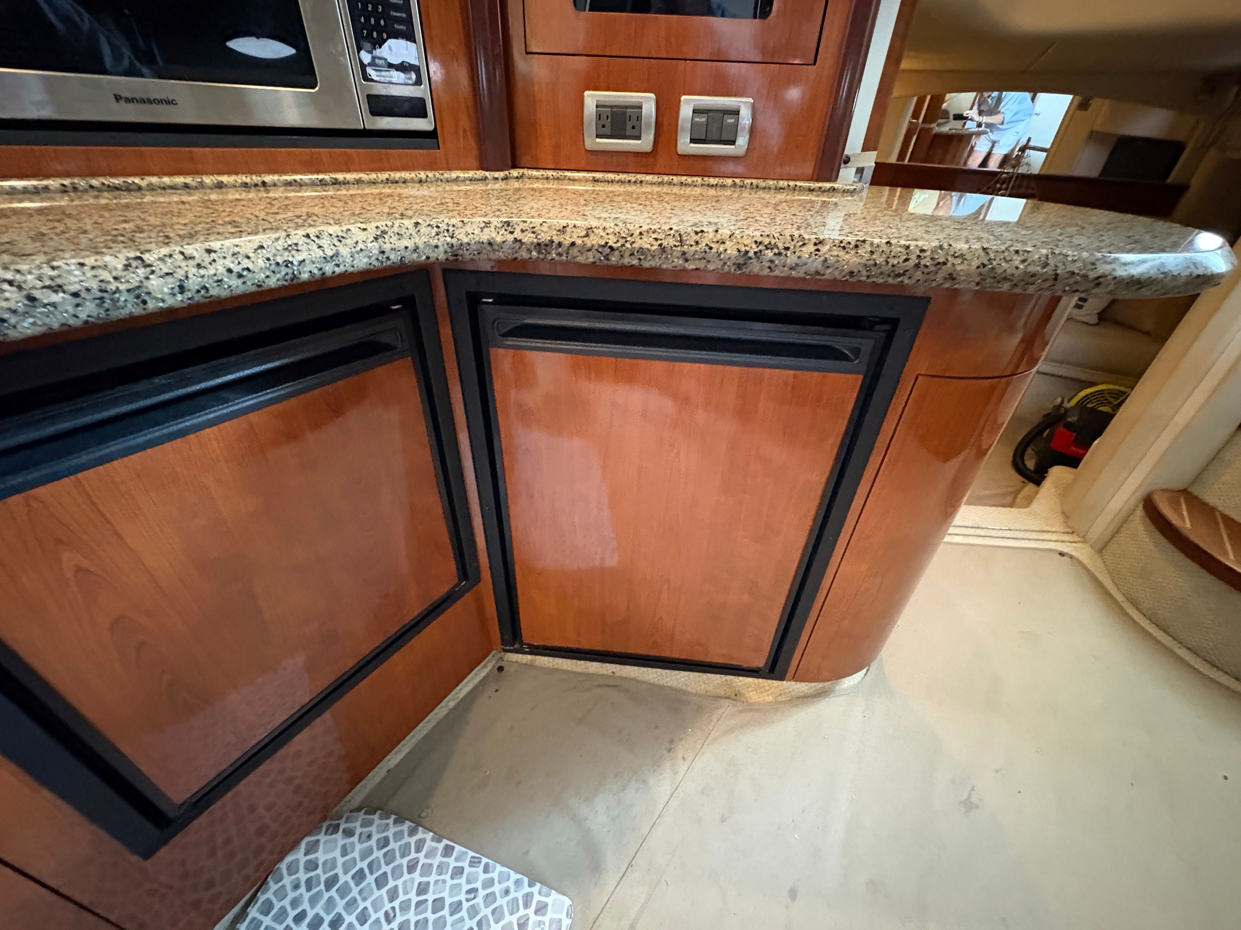 Interior of 2005 Sea Ray 420 Sundancer with wood paneling.
