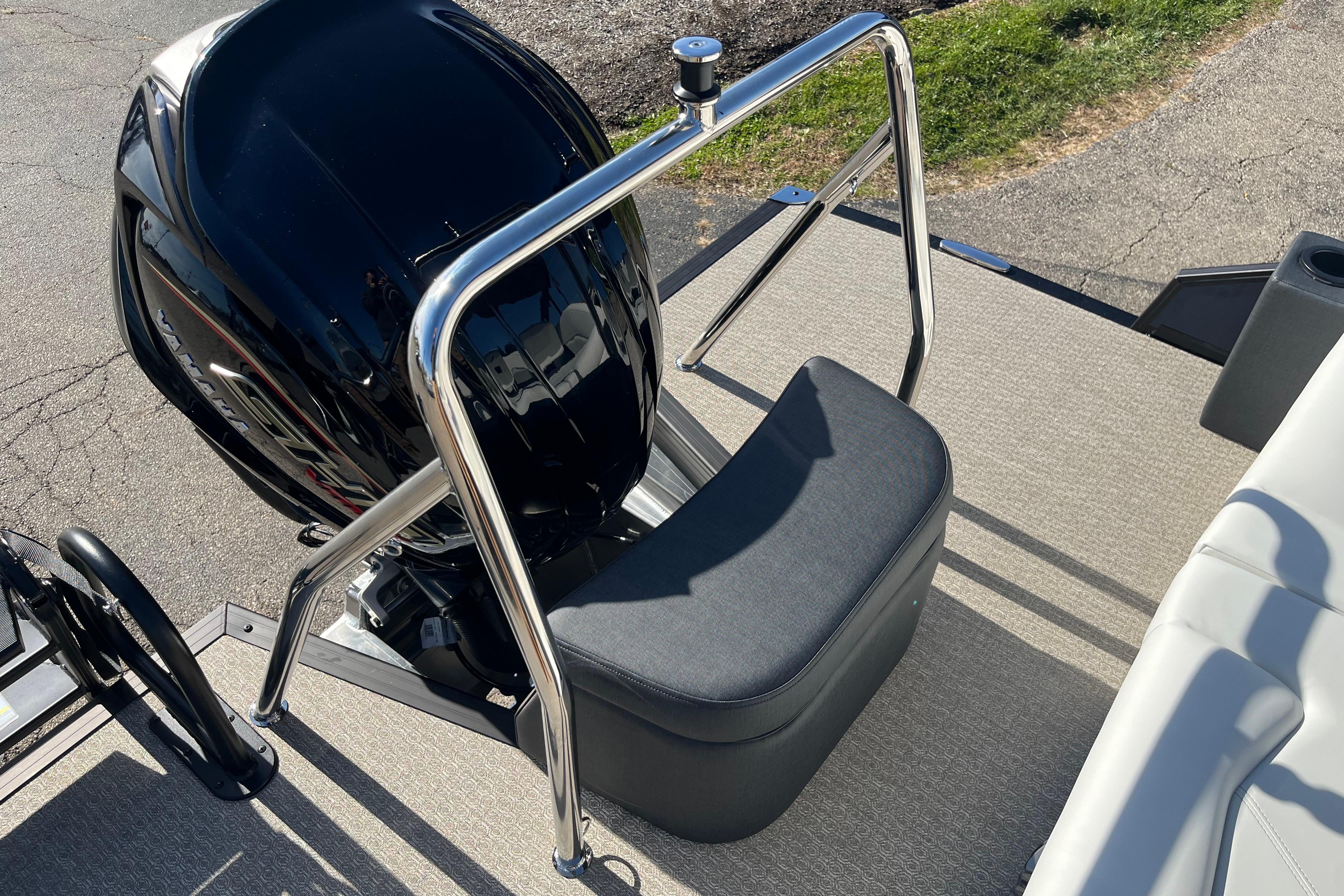2026 Evotti 523CS boat with sleek black motor and cushioned seating.