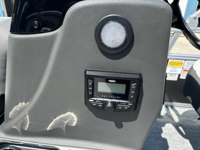 Control panel of 2026 Sun Tracker Bass Buggy 18 DLX with speaker and display.