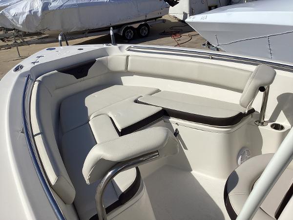 2022 Sailfish 220 CC boat interior with cushioned seating and stainless steel railings.