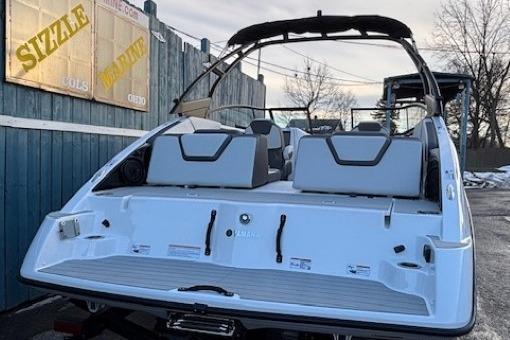 2026 Yamaha Boats AR250, rear view, sleek design, docked outdoors.