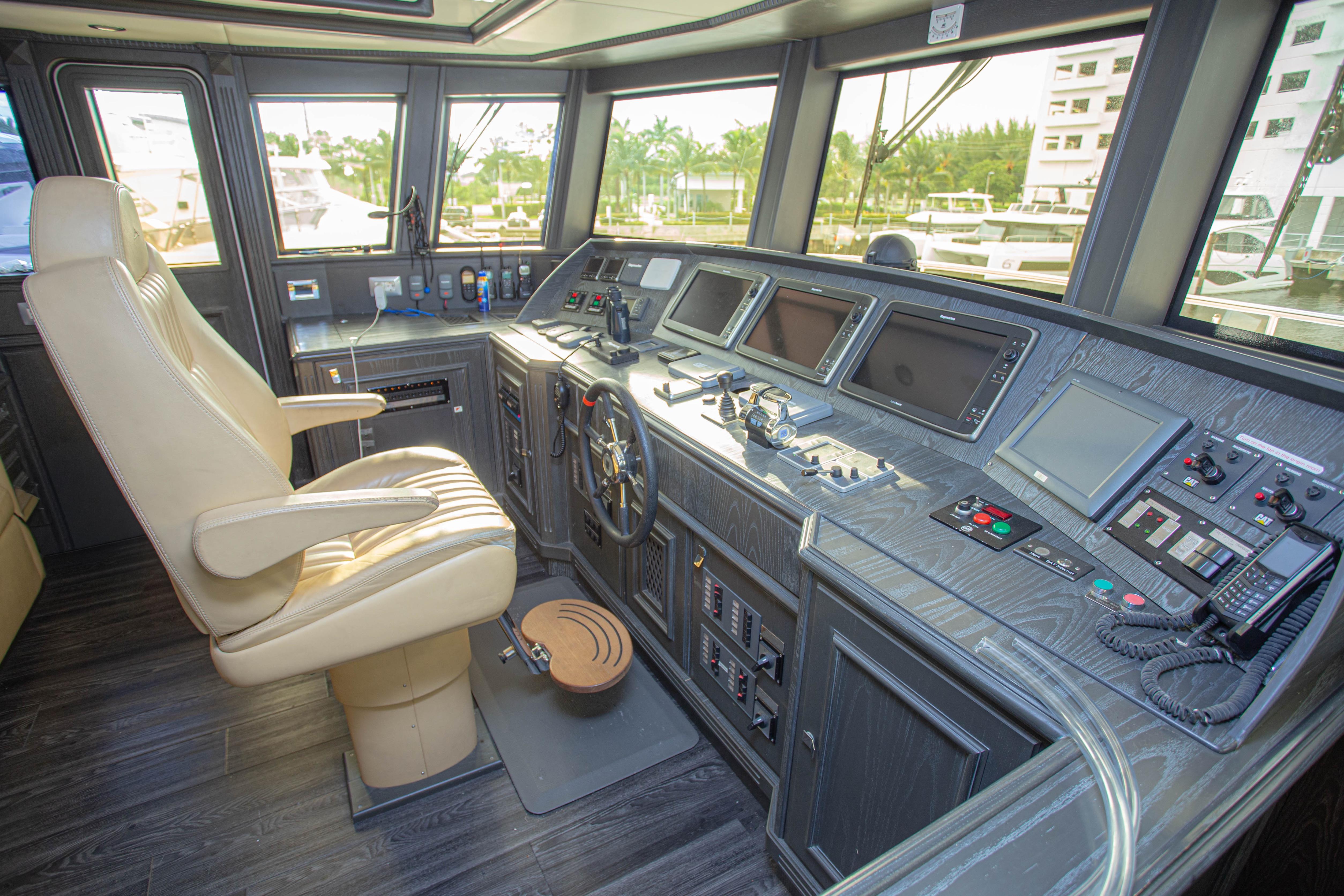 Luxurious helm of 2014 Fifth Ocean Yachts 24m Displacement Explorer Yacht with advanced navigation systems.