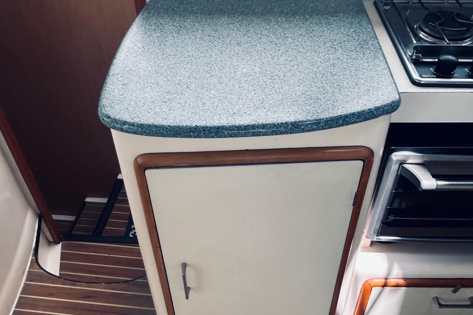 2001 Robertson & Caine Leopard yacht kitchen with countertop and stove.
