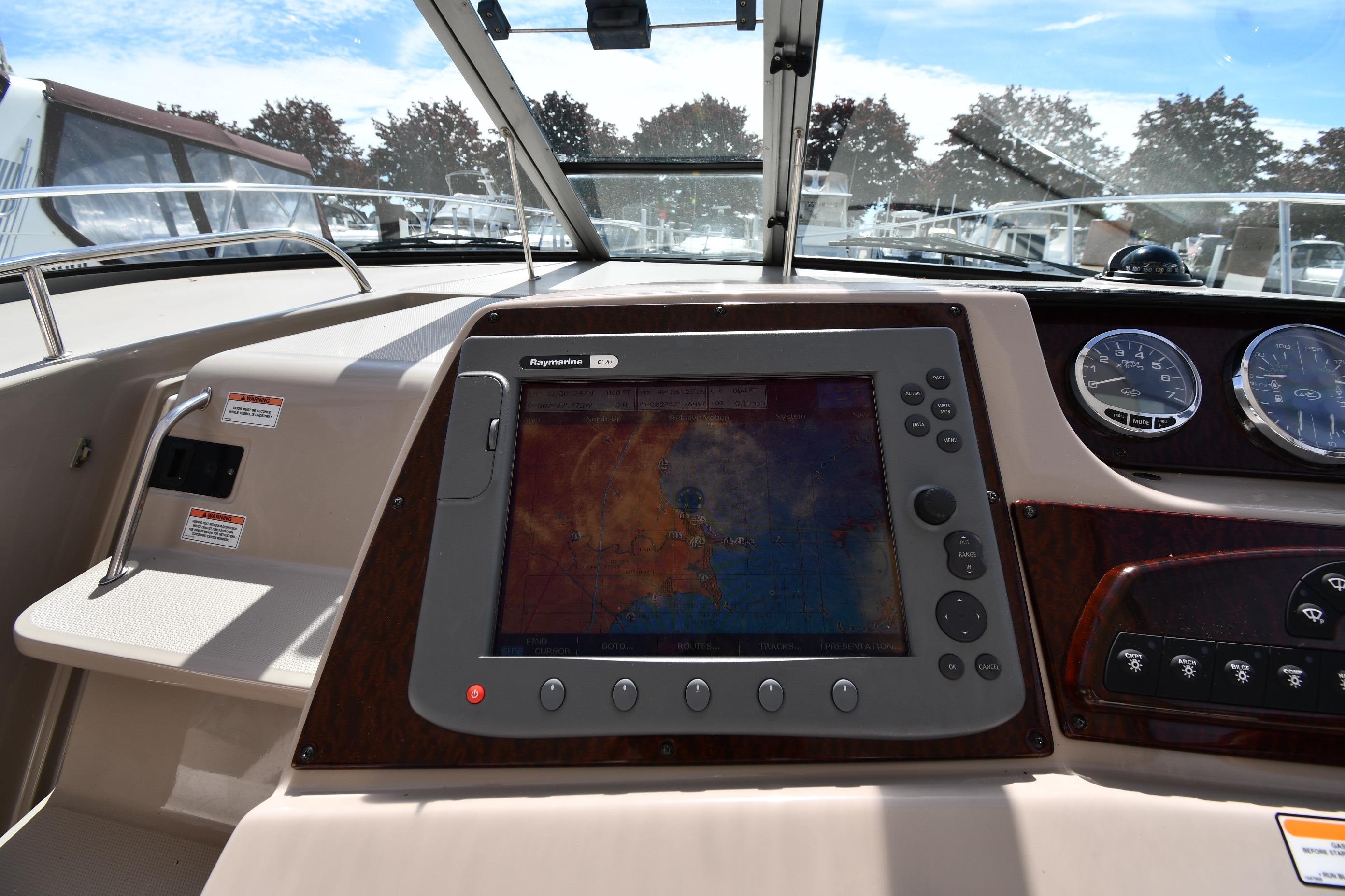 2008 Sea Ray Sundancer 350 dashboard with navigation system and gauges.