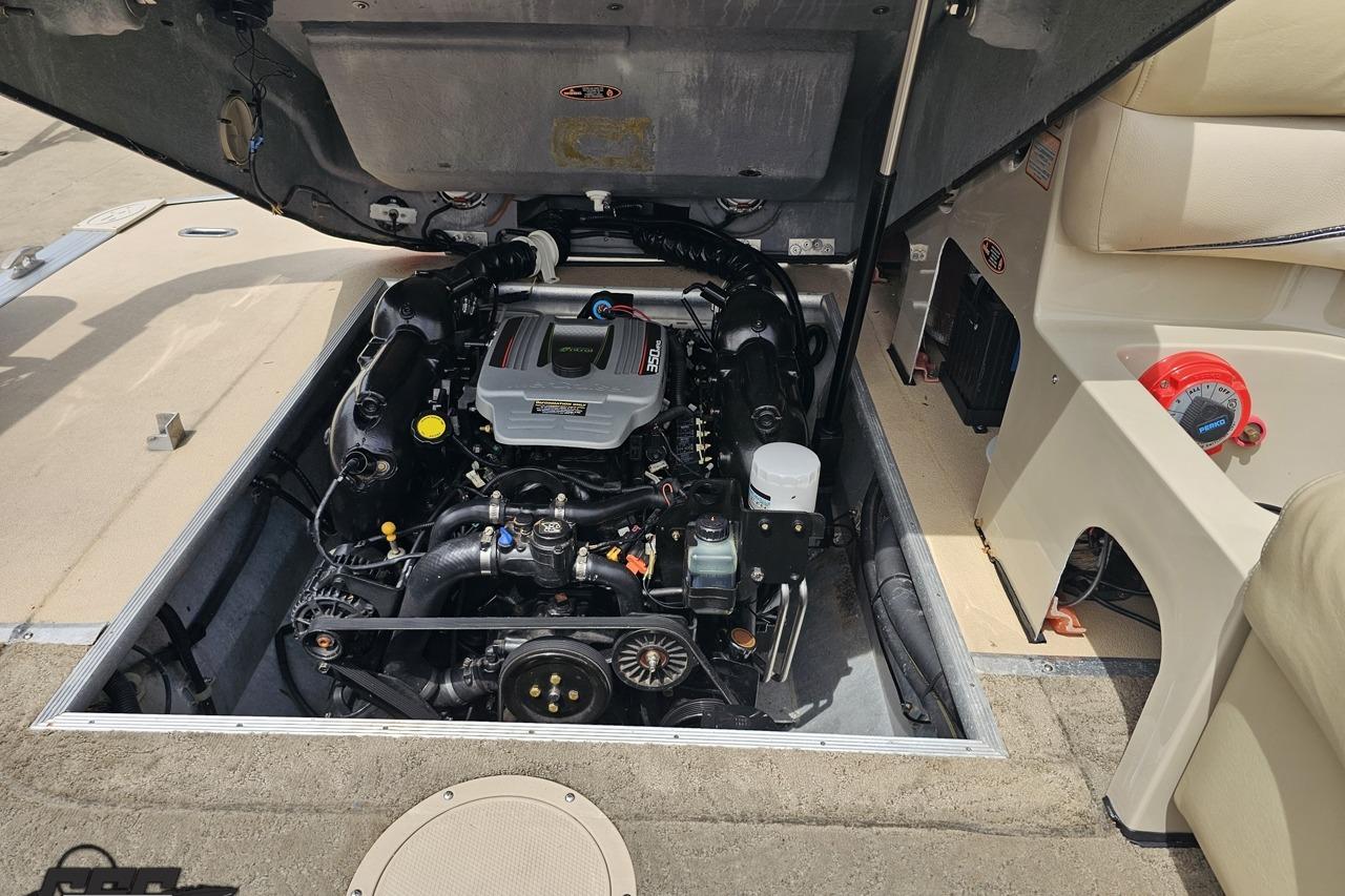 Engine compartment of a 2012 Harris FloteBote 230 Grand Mariner SEL pontoon boat.
