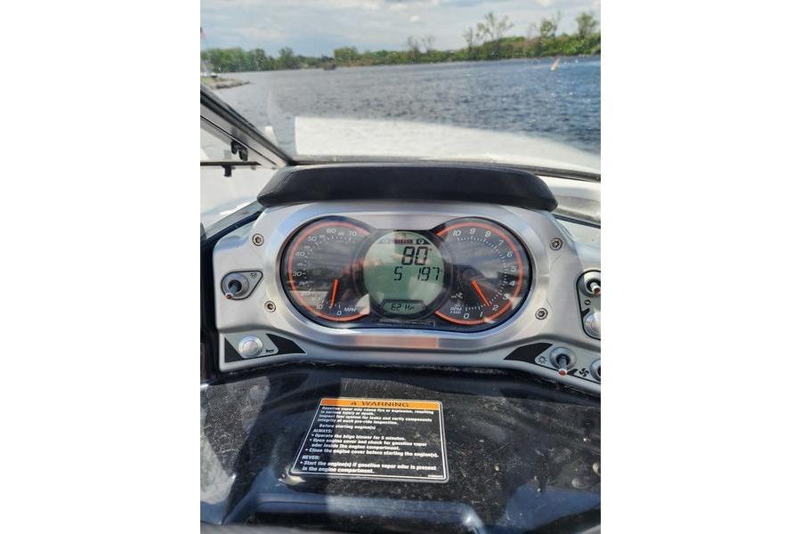 Dashboard of a 2012 Sea-Doo Sport Boats 180 Challenger on a lake.
