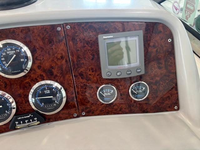 Dashboard of 2005 Formula 400 SS boat with gauges and Raymarine display.