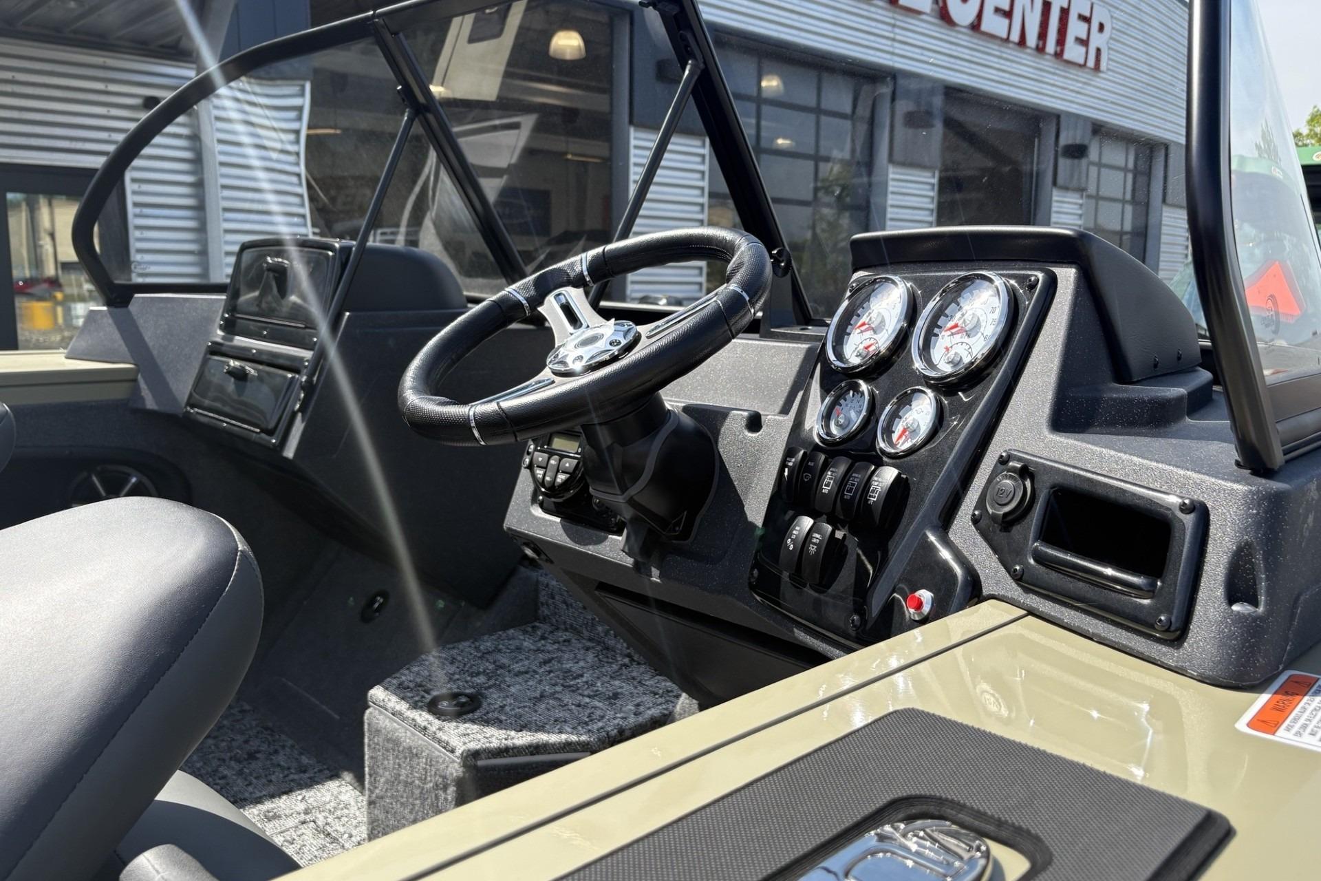 2026 Tracker Targa V-18 Combo boat dashboard with steering wheel and gauges.