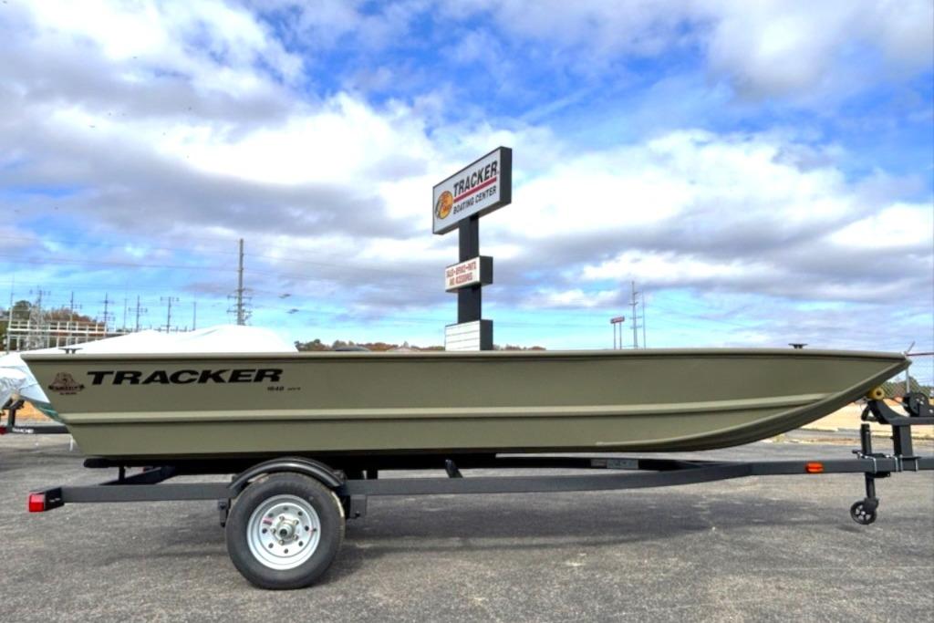 2026 Tracker Grizzly 1648 Utility boat on trailer under cloudy sky.