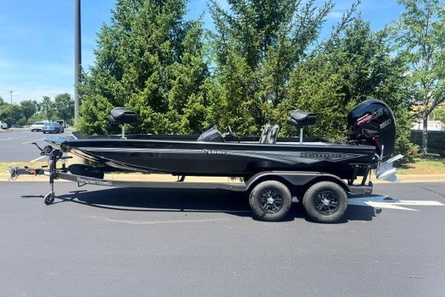 2026 Ranger RT198P boat on trailer, parked outdoors, with trees in the background.