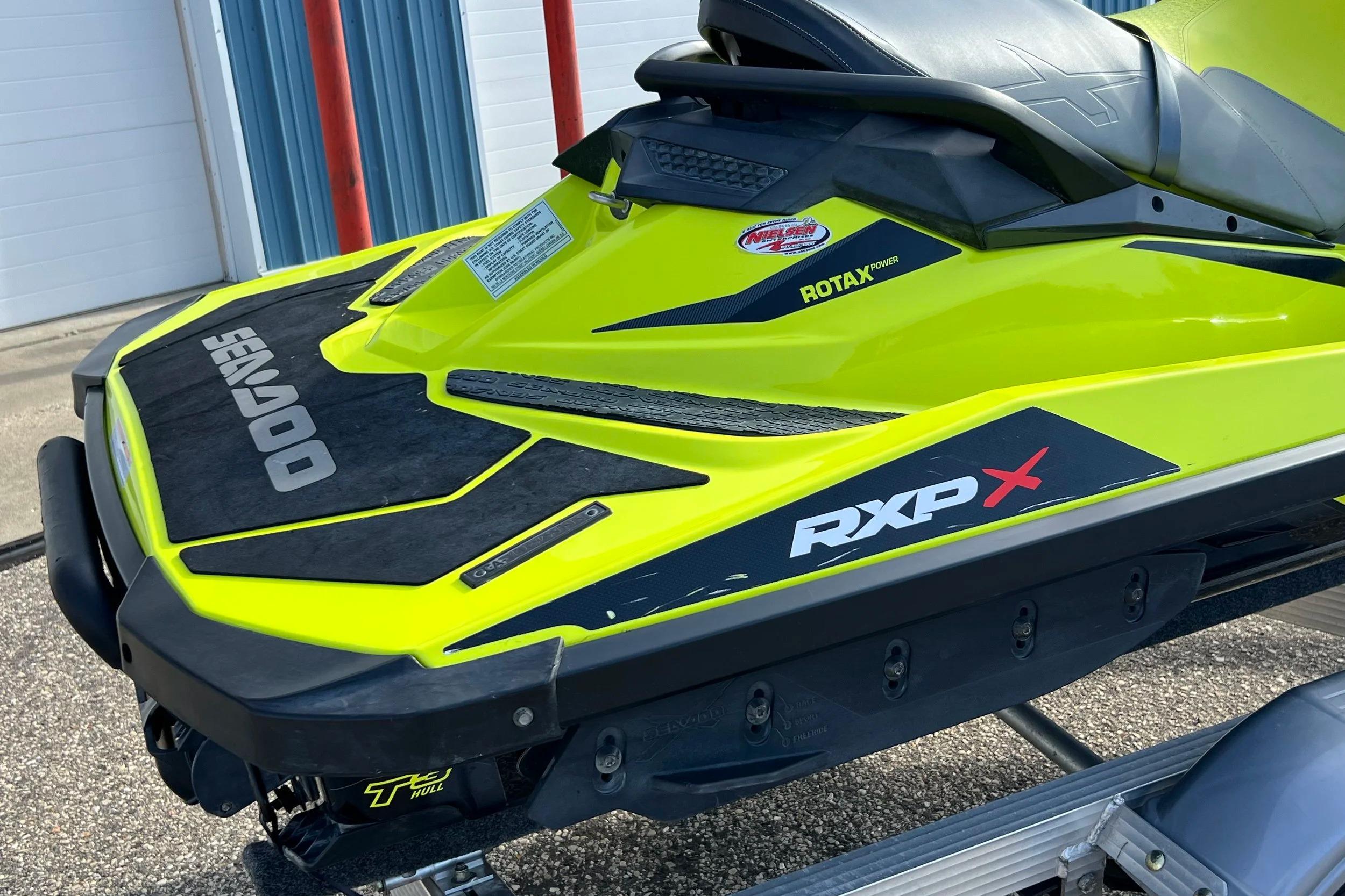 2018 Sea-Doo RXP-X 300 jet ski, vibrant yellow, on a trailer.