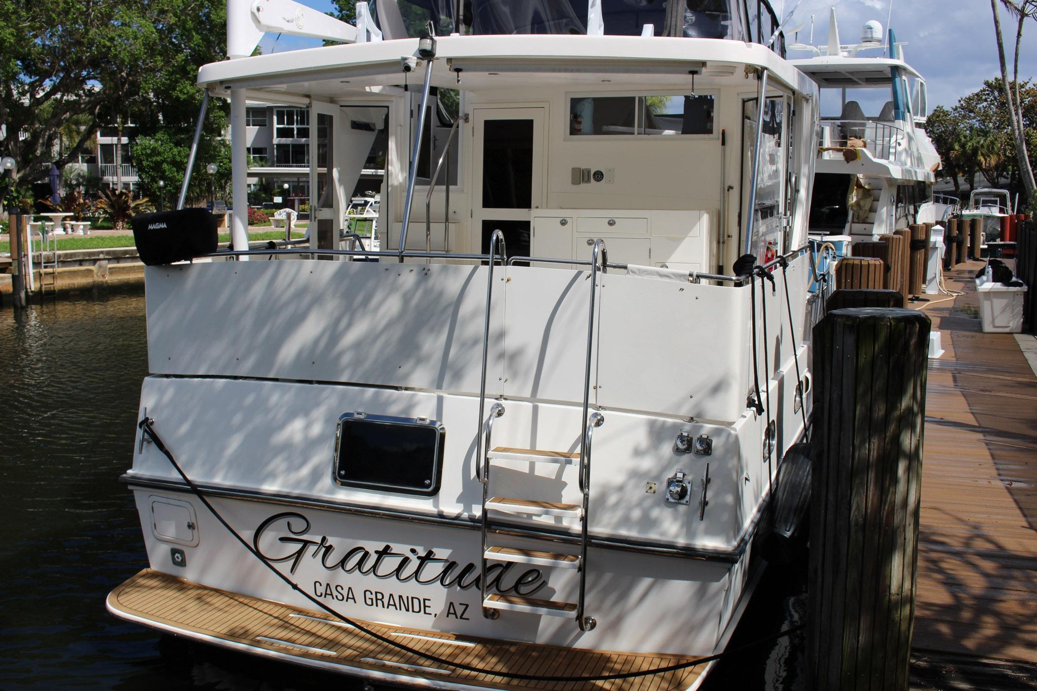 2007 Jefferson 45 Motor Yacht docked, rear view with "Gratitude" name visible.