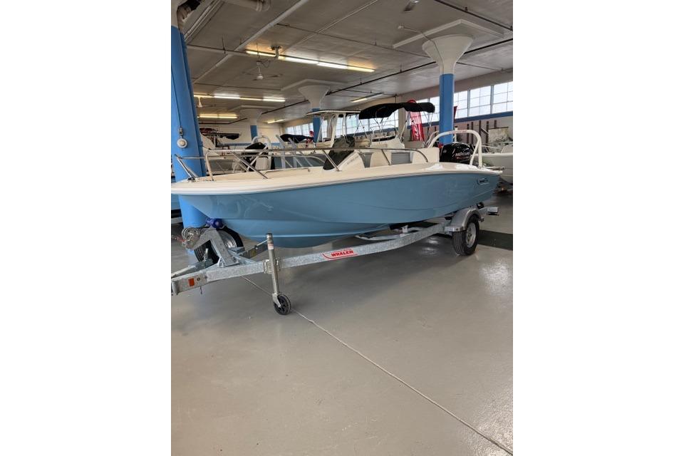 2026 Boston Whaler 160 Super Sport boat on trailer in showroom.