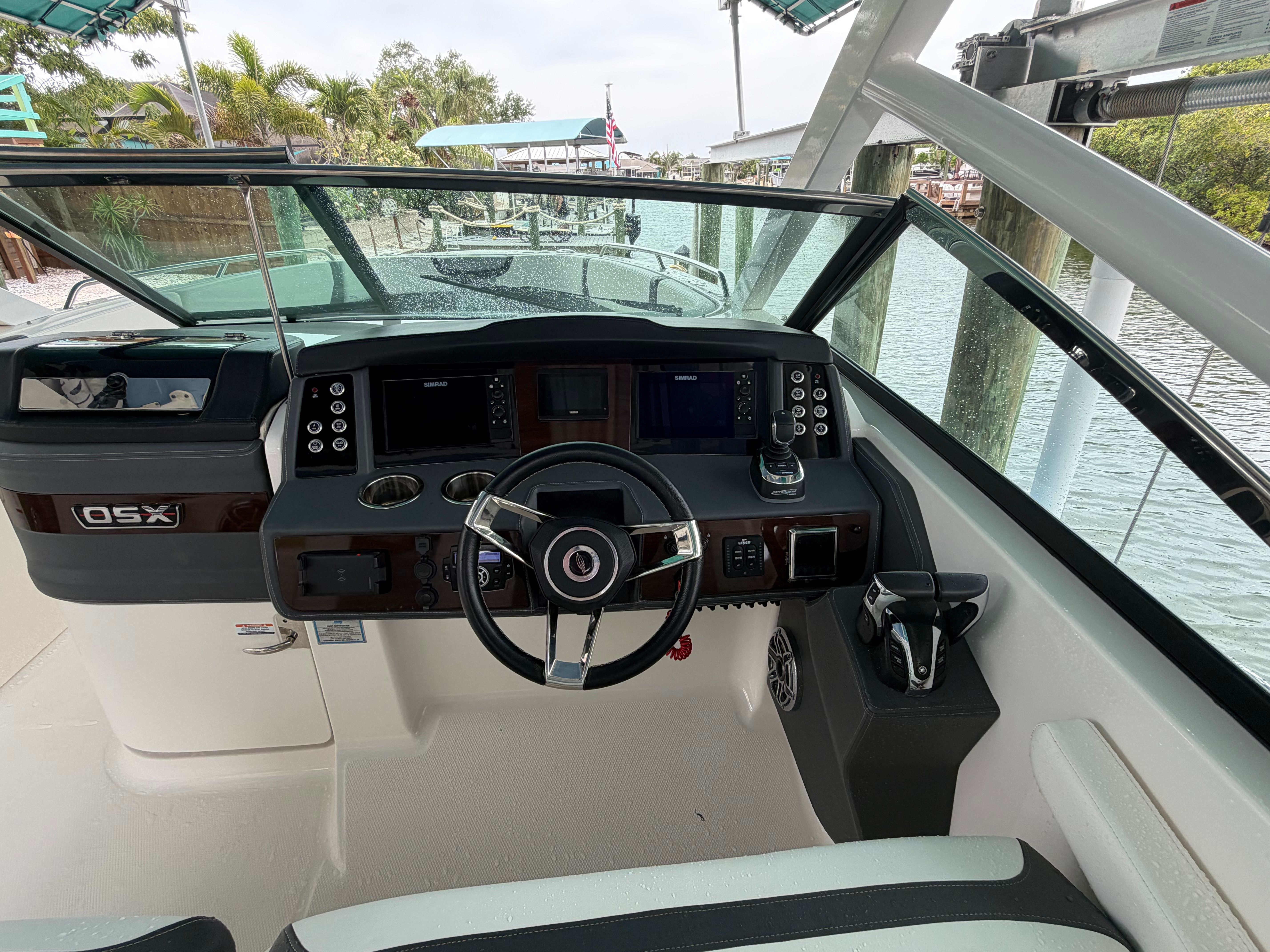 The cockpit of a Chaparral 280 OSX boat with modern steering and instruments.