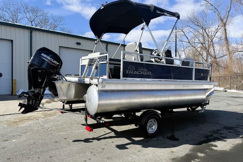 2026 Sun Tracker Bass Buggy 16 XL Select pontoon boat with Mercury outboard motor.