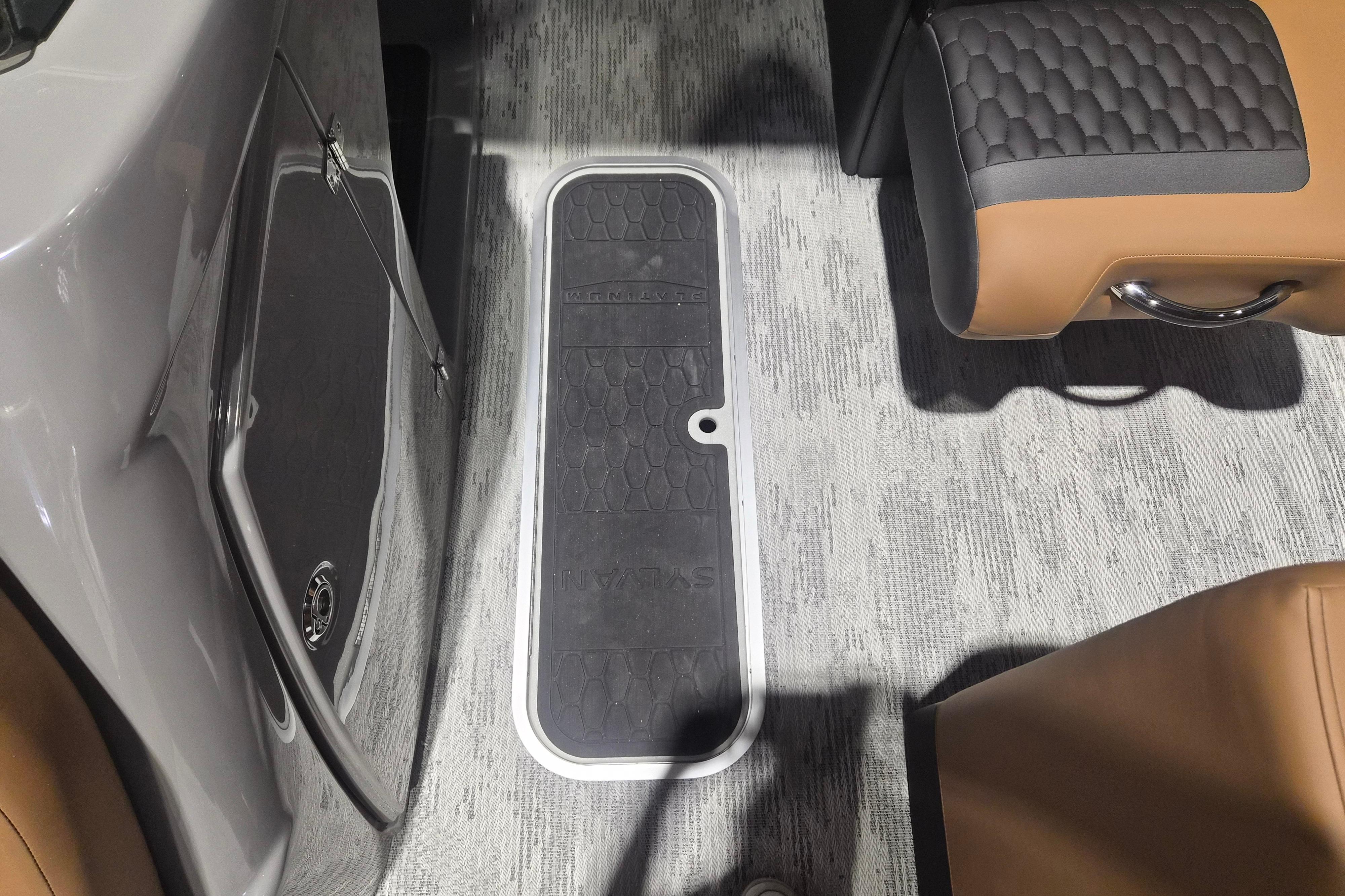 Interior of 2026 Sylvan L3 SLZ boat, featuring sleek seating and flooring design.