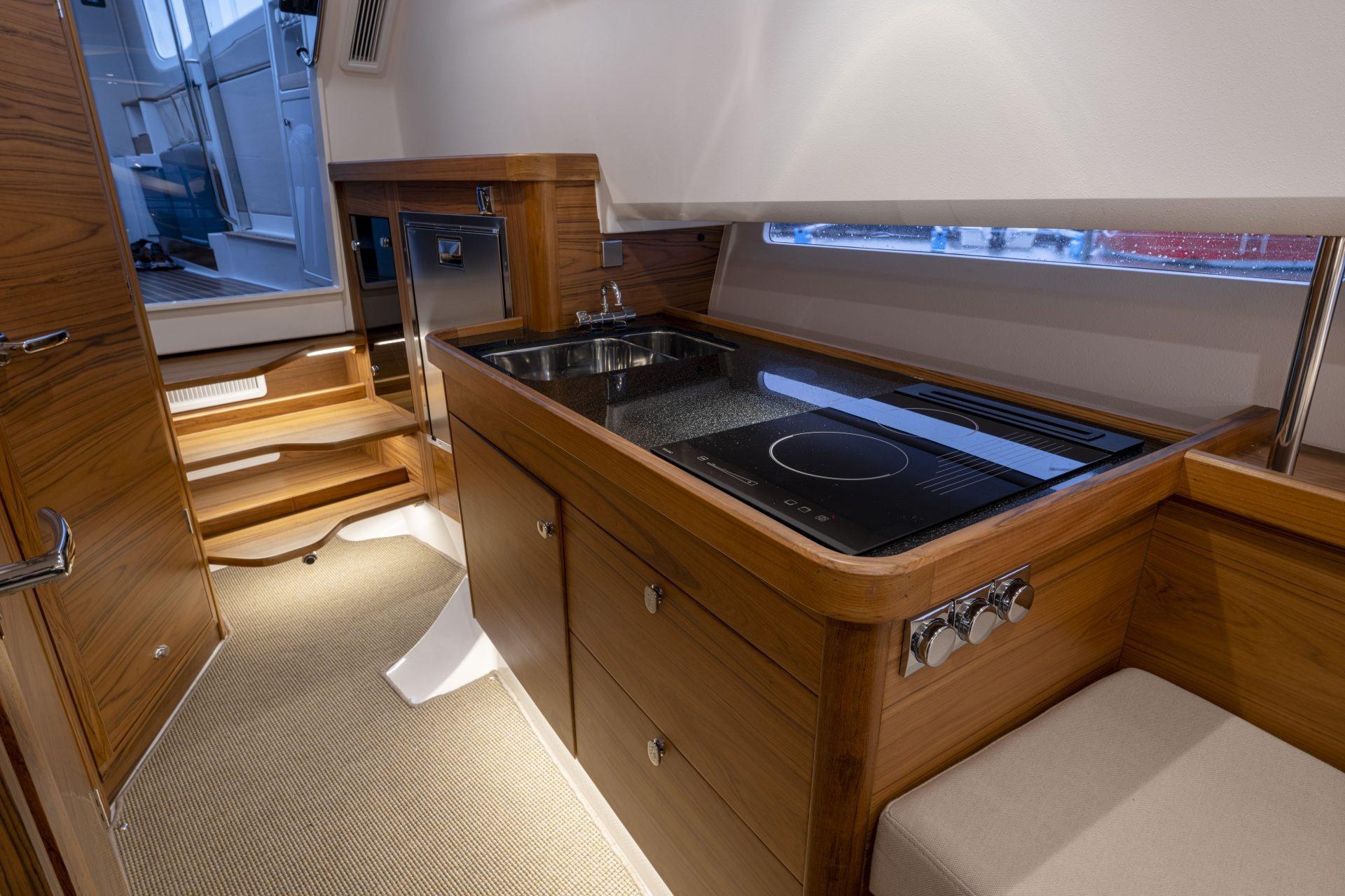 Interior of Nimbus Commuter 11 yacht, modern kitchen, 2025 model.