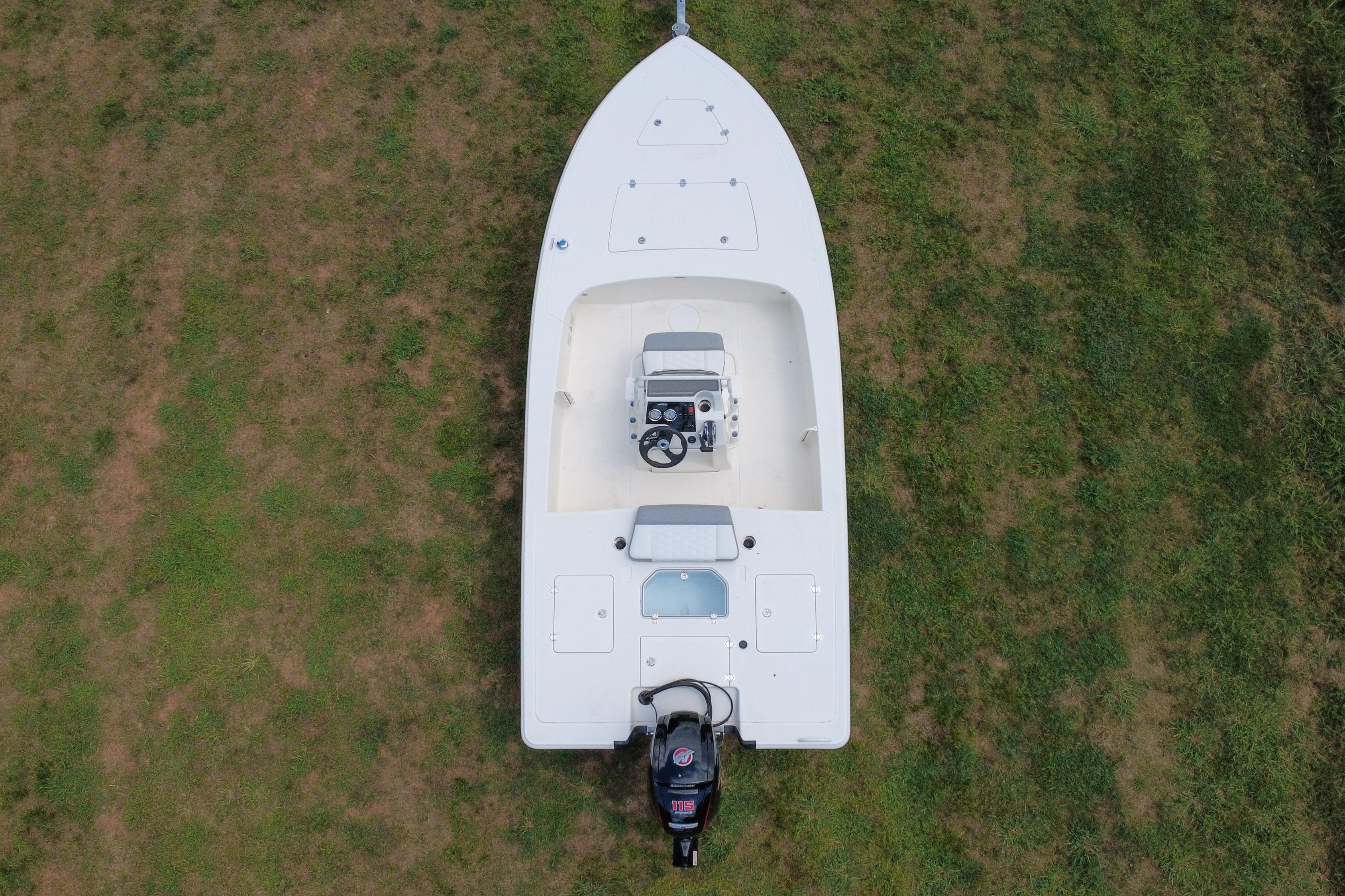 Top view of a 2026 Mako 18 Pro Skiff boat on grass.