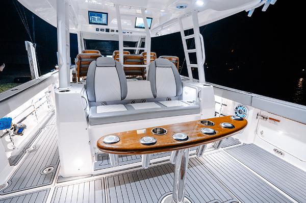 Manufacturer Provided Image: 2025 Everglades 455 Center Console boat interior with seating and fishing rod holders.