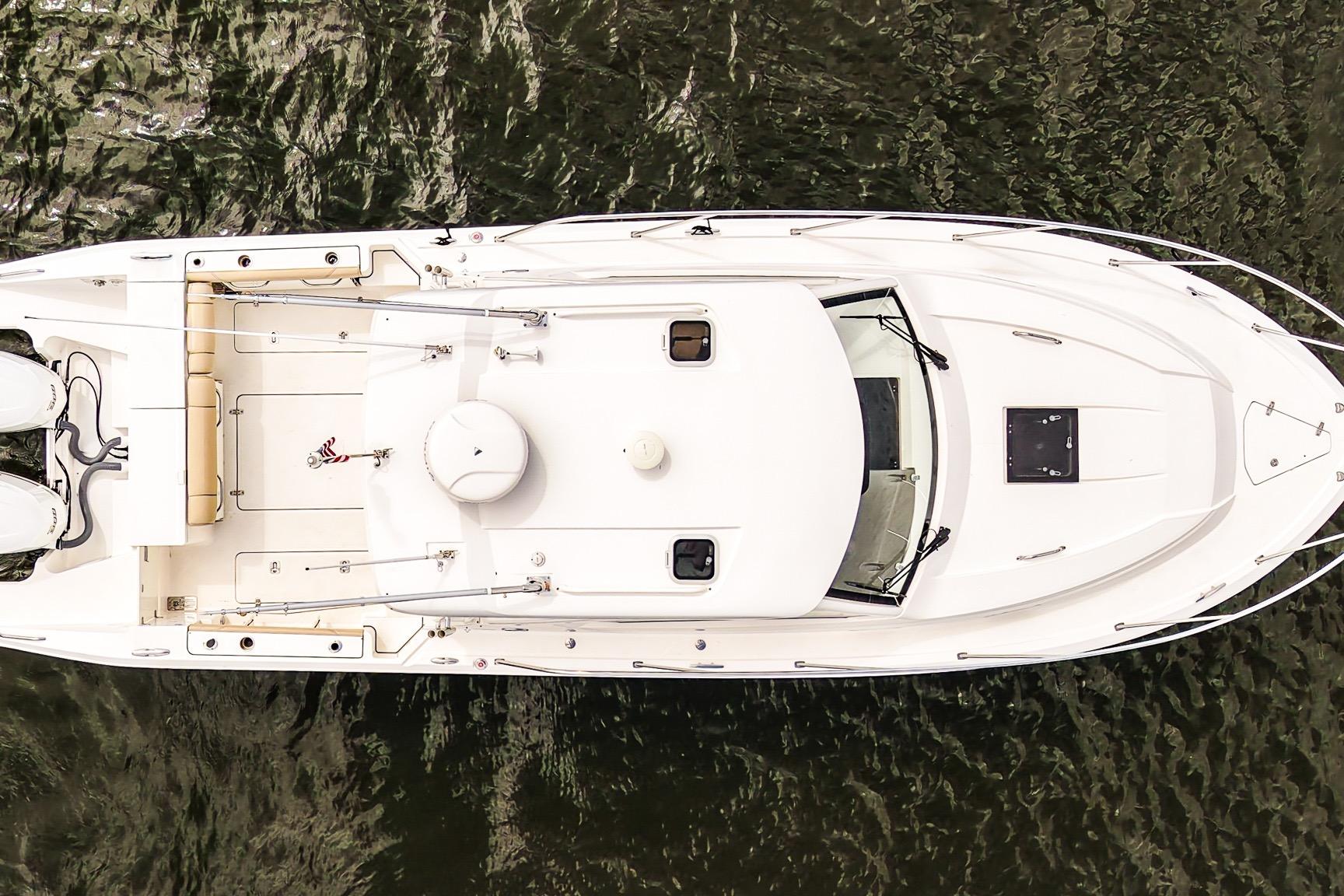 Aerial view of 2020 Pursuit OS 325 Offshore boat on water.