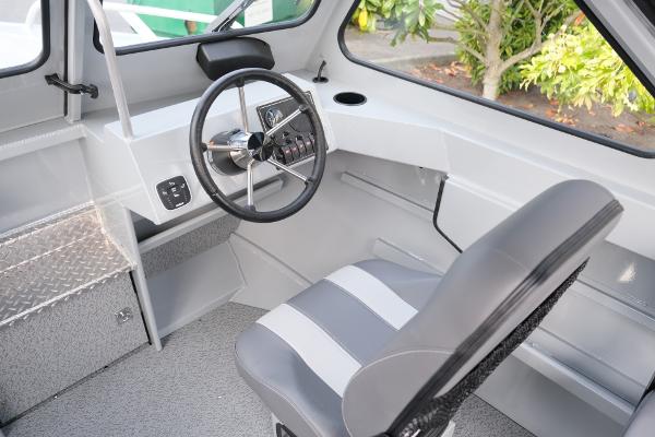 2024 Hewescraft 180 Pro-V ET boat interior with steering wheel and seating.