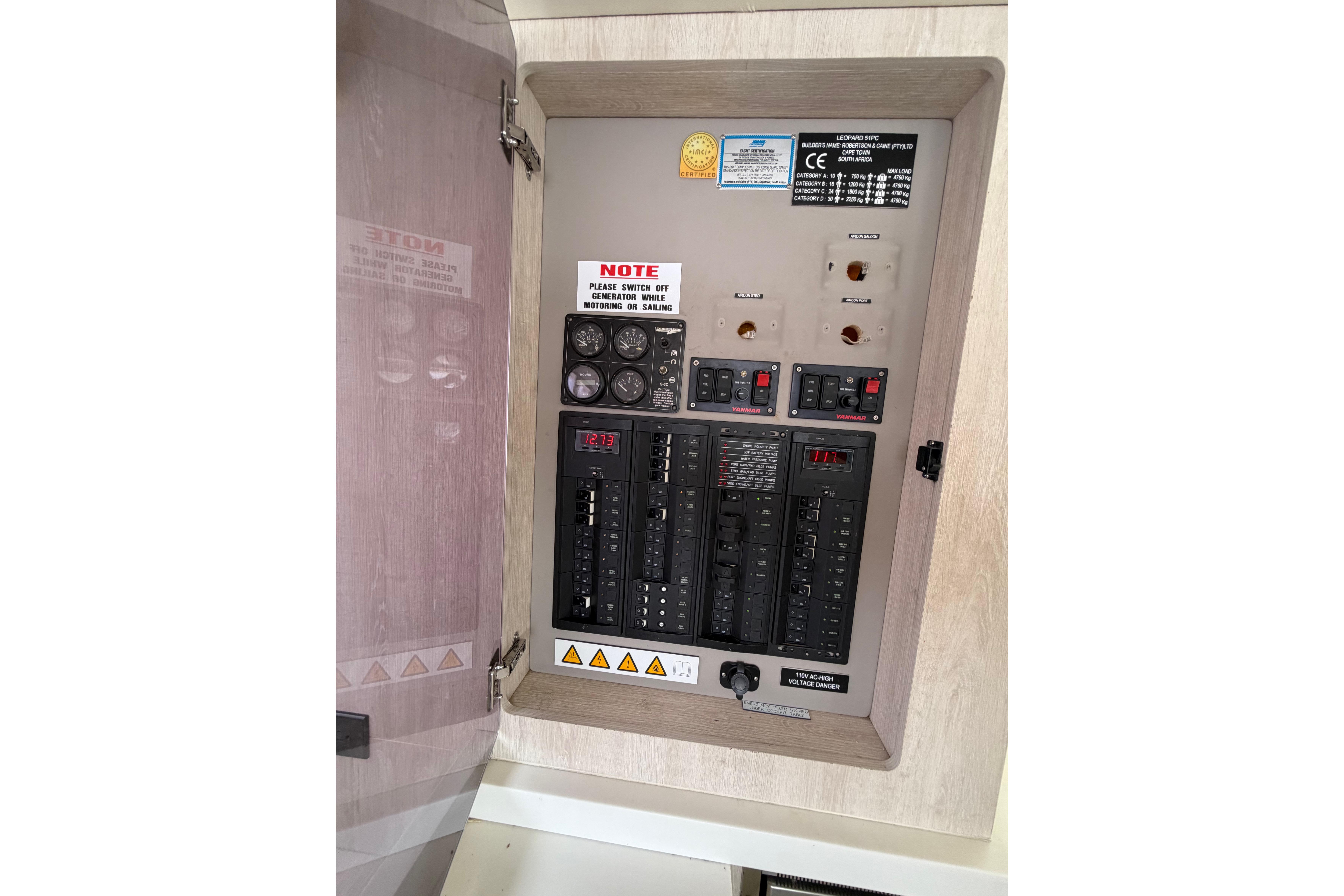Electrical panel inside 2015 Leopard 51 Powercat, featuring switches and gauges.