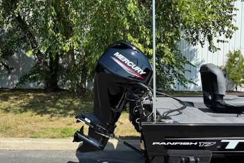 2026 Tracker Panfish 17 boat with Mercury outboard motor, parked outdoors.
