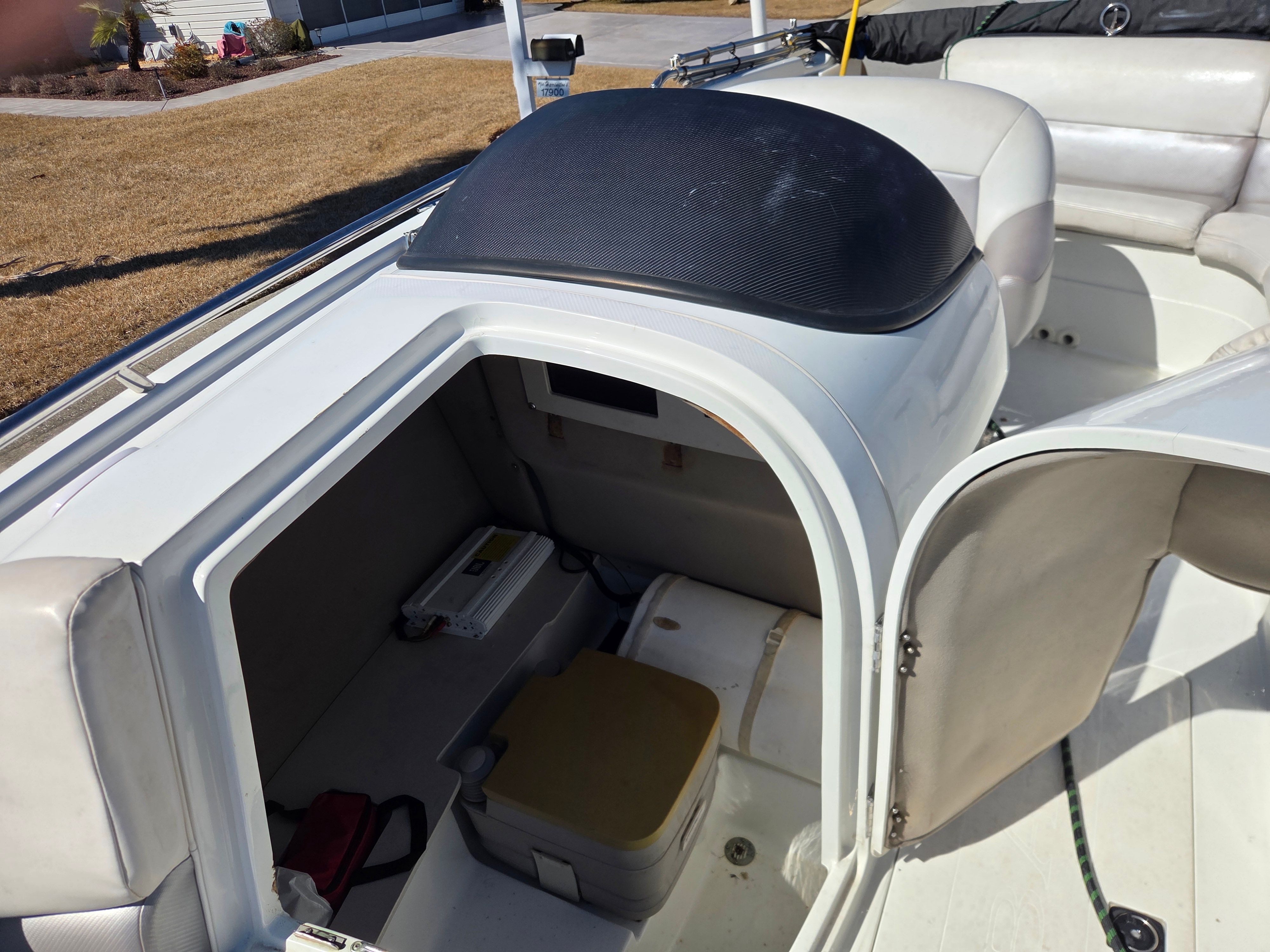 Interior of a 1997 Cobalt 23LS boat with storage area.