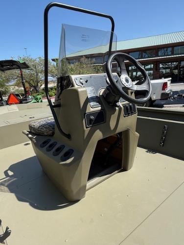 2025 Tracker Grizzly 1860 CC boat console with steering wheel and controls.