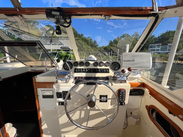 The cockpit of a 1985 Viking 35 Express with a steering wheel and various instruments.