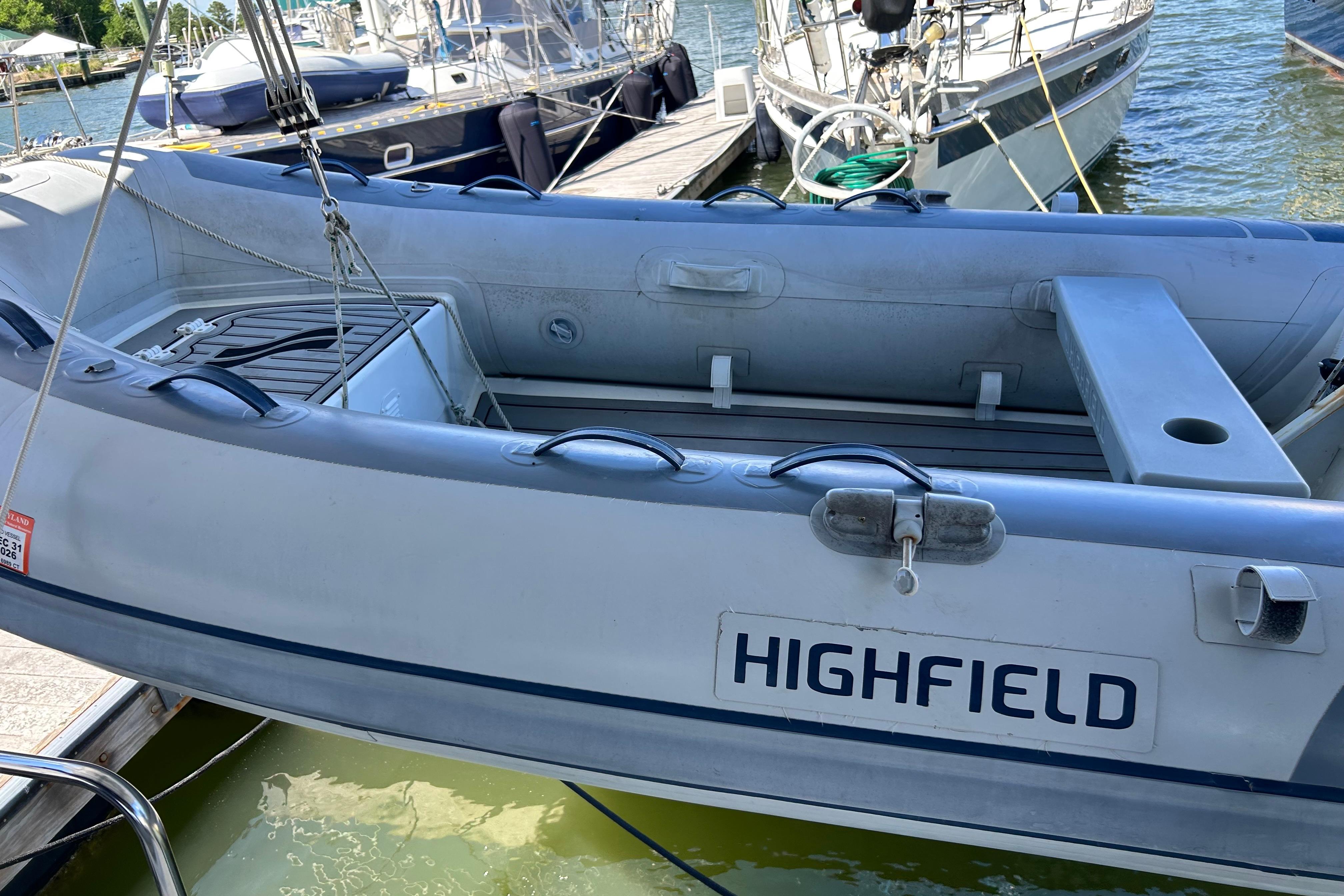 Highfield inflatable boat docked near Beneteau Oceanis 46, 2008 model.