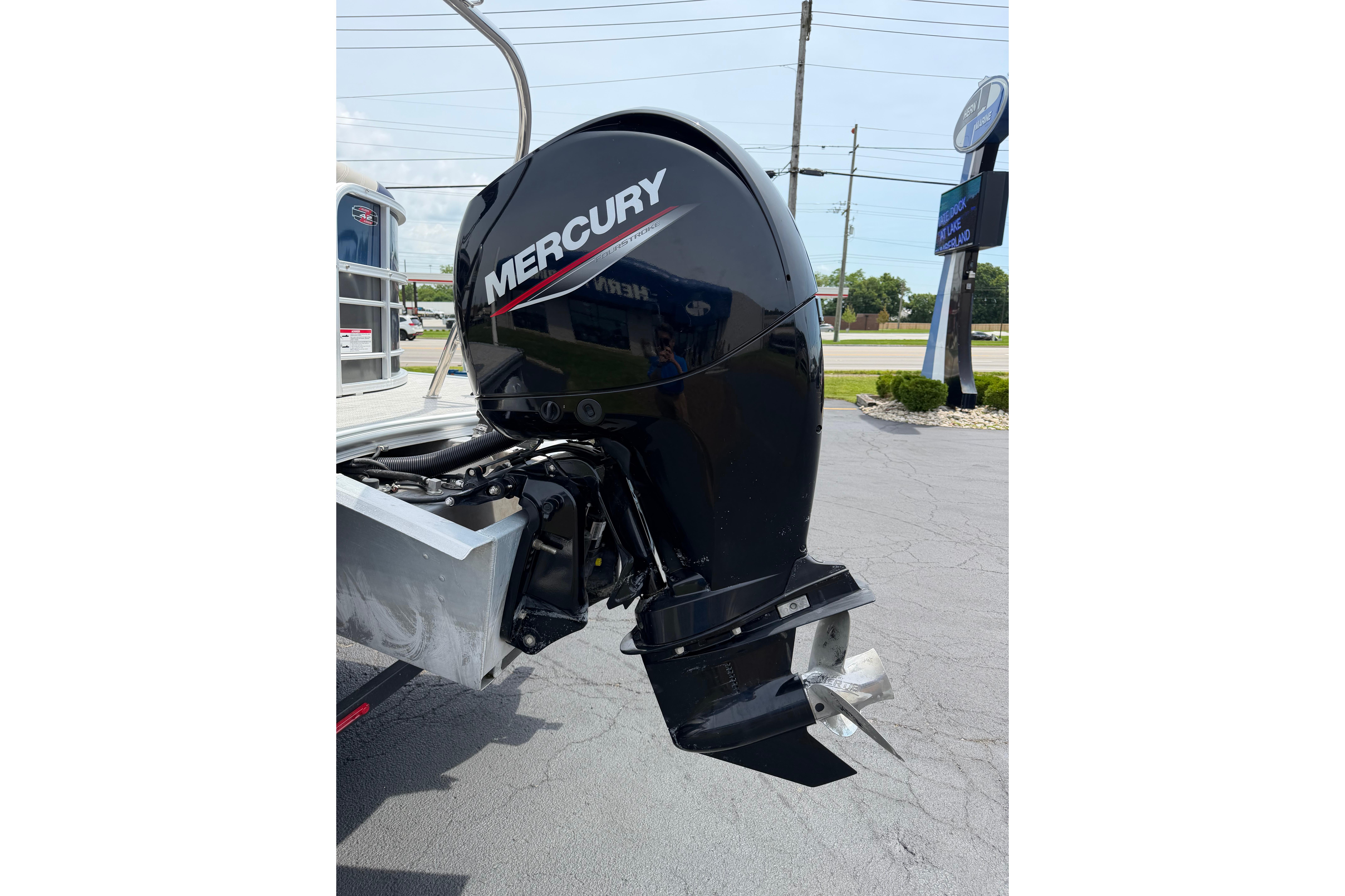 2021 South Bay 224RS LE with Mercury outboard motor in parking lot.